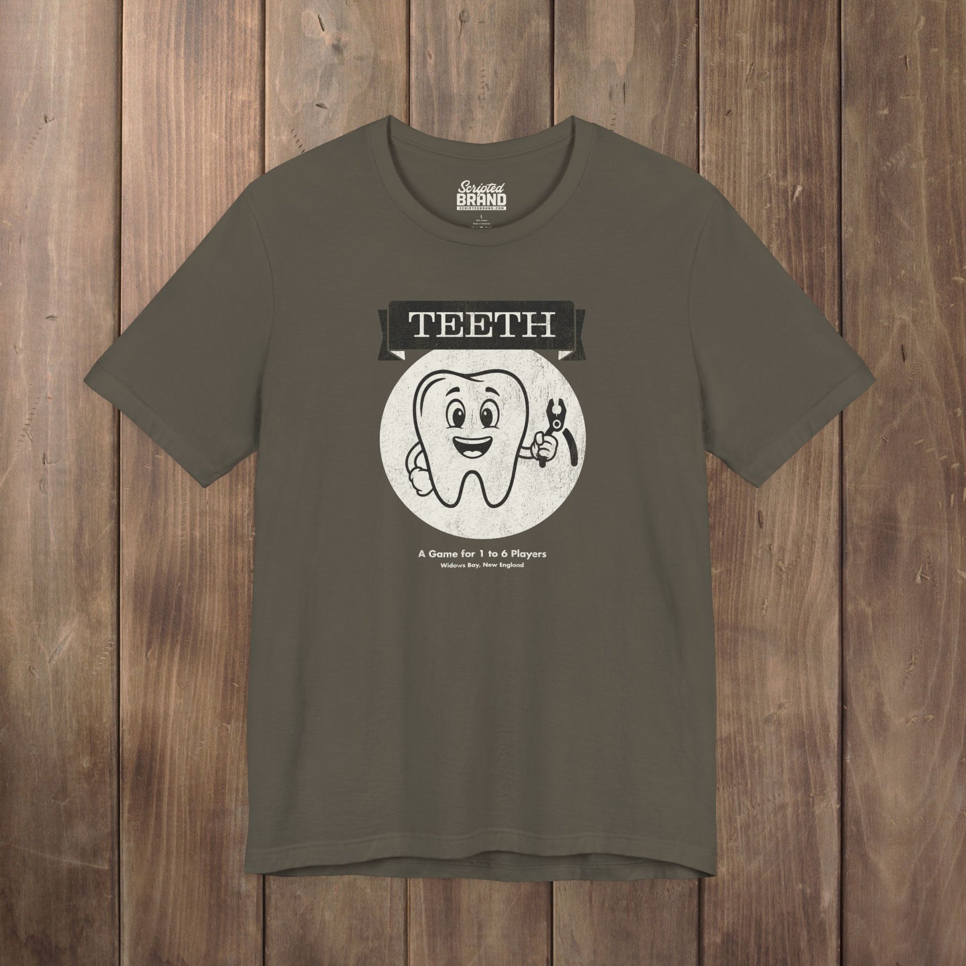 Army green Bella+Canvas tee with the vintage TEETH board game box cover from Widow's Bay, a smiling tooth holding pliers