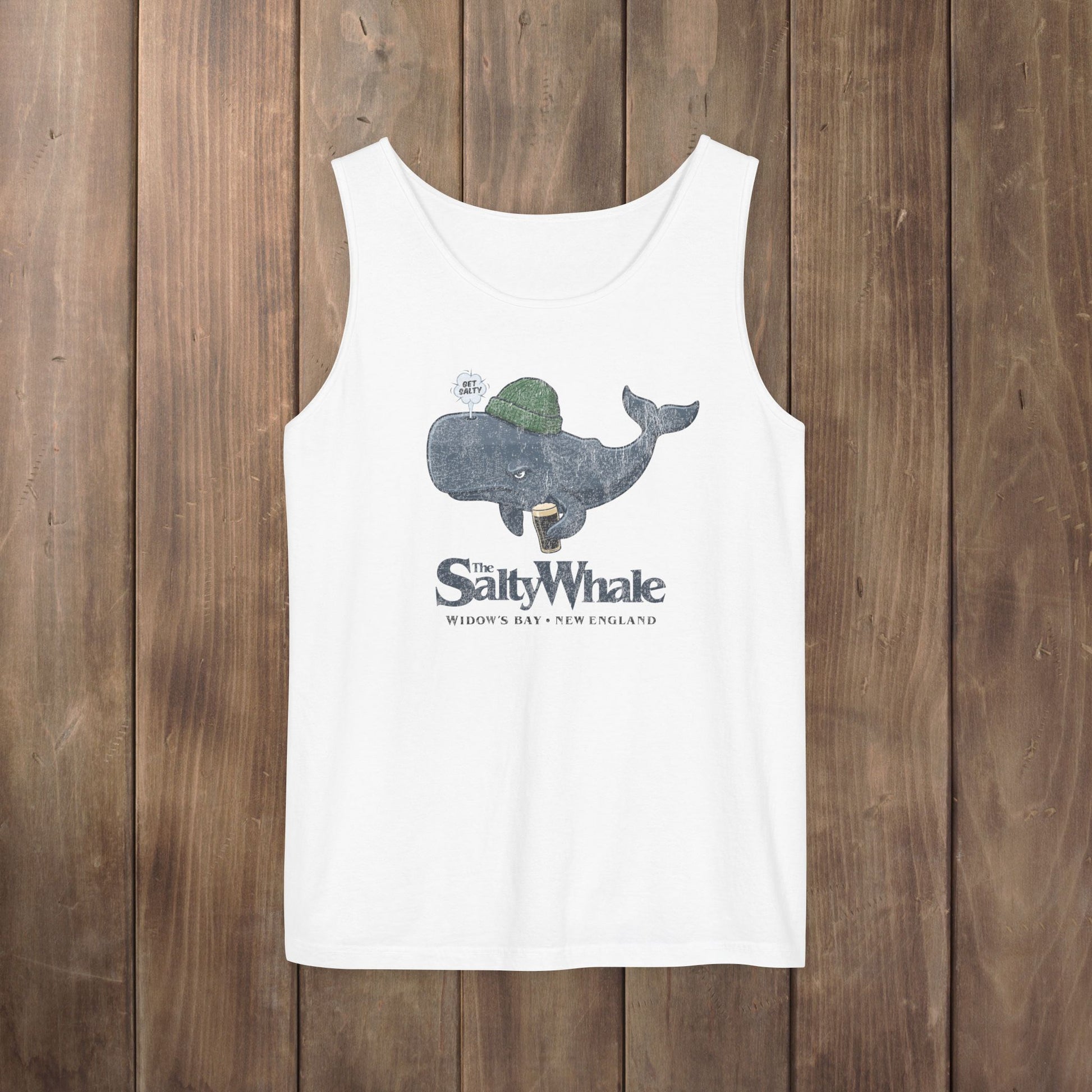 White Comfort Colors tank with the Salty Whale logo from Widow's Bay, a beanie-wearing cartoon whale drinking dark beer