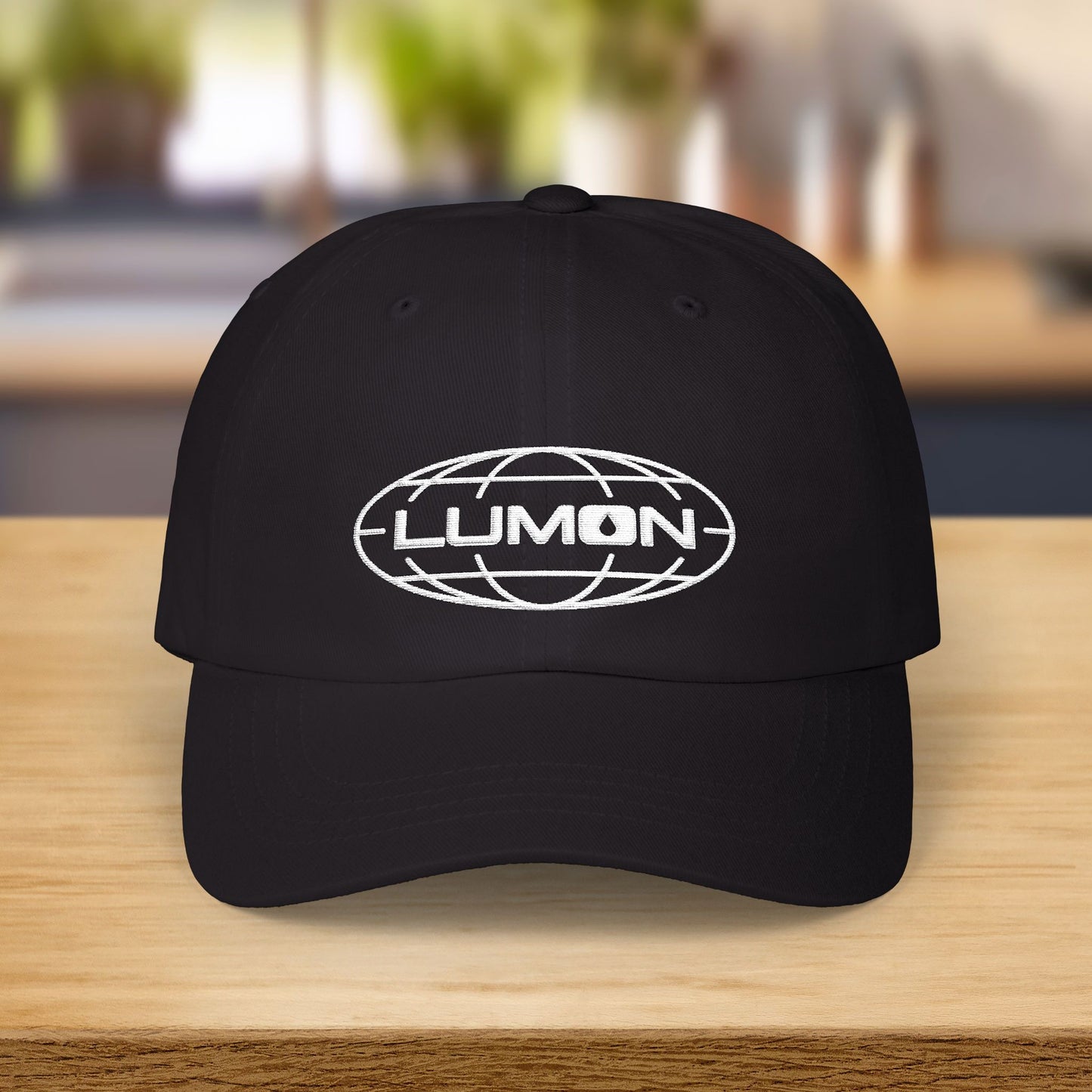 Black dad hat with white embroidered Lumon Industries globe logo, Severance-inspired design cap