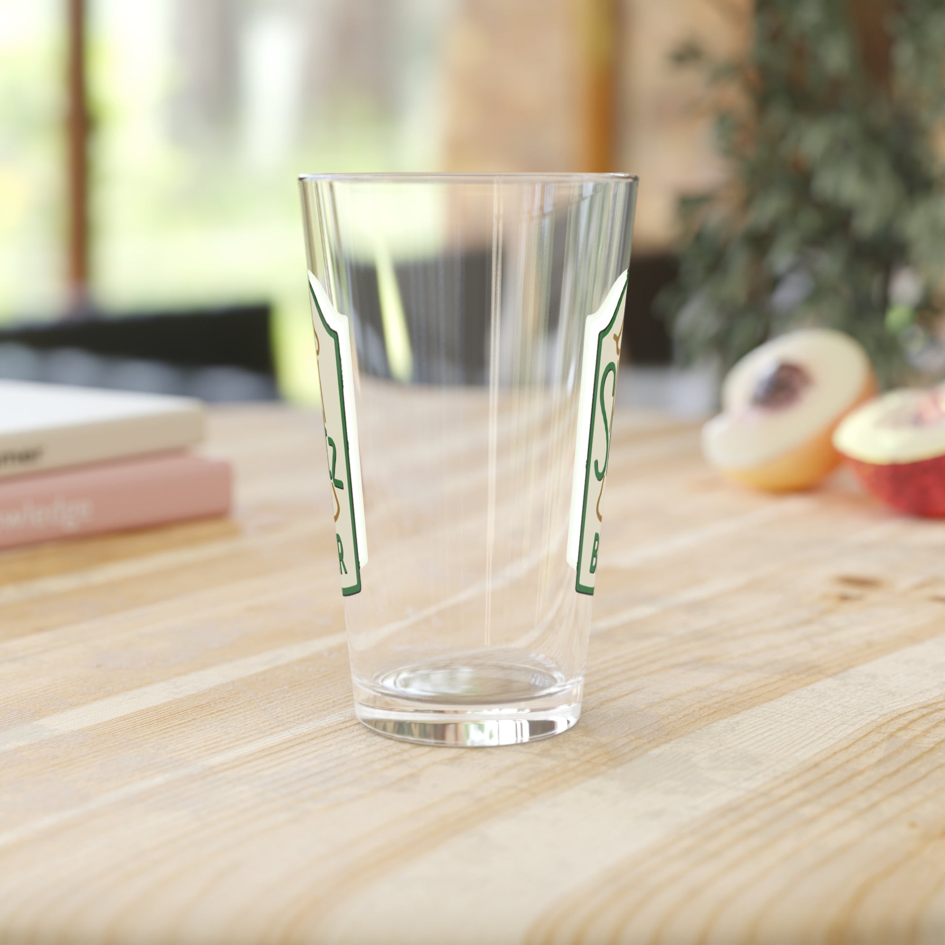 Side view mockup of 16 oz clear pint glass with Shotz Beer logo graphic from TV Show Laverne & Shirley, printed on both sides.