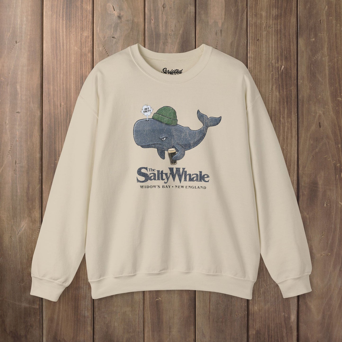 Sand colored The Salty Whale cartoon mascot crewneck sweatshirt inspired by Widow's Bay Apple TV series, vintage pub fan pullover
