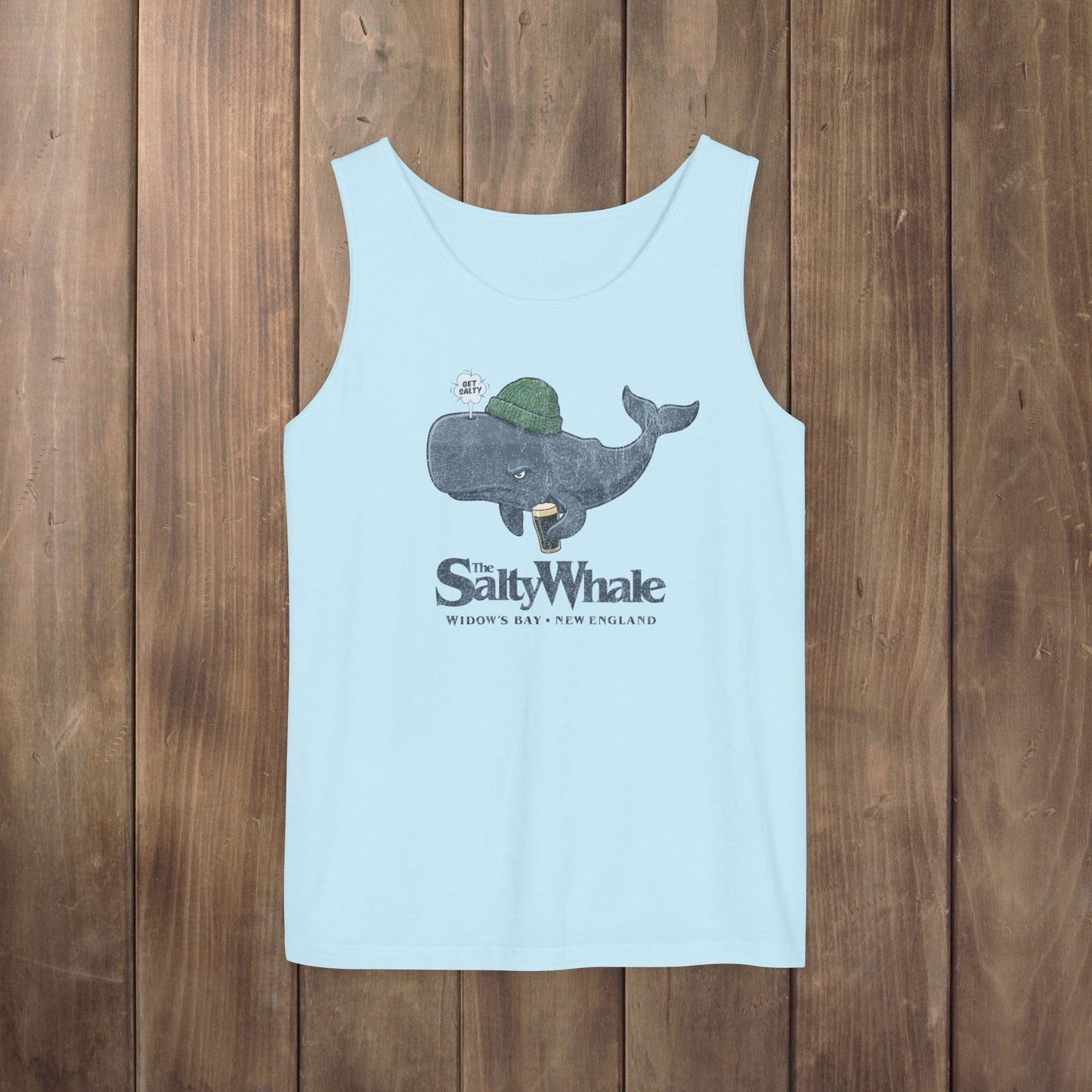 Light blue Comfort Colors tank with the Salty Whale logo from Widow's Bay, a beanie-wearing cartoon whale drinking dark beer