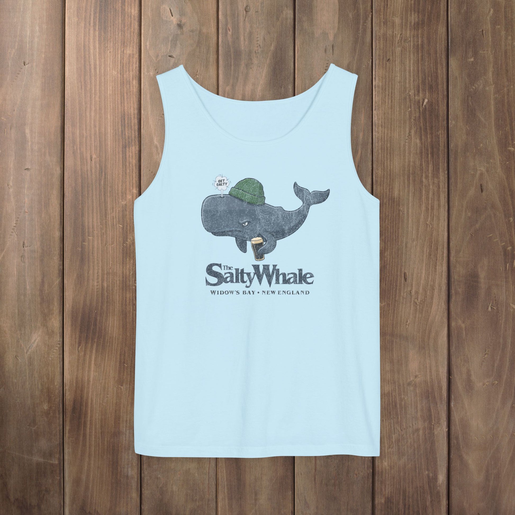 Light blue Comfort Colors tank with the Salty Whale logo from Widow's Bay, a beanie-wearing cartoon whale drinking dark beer