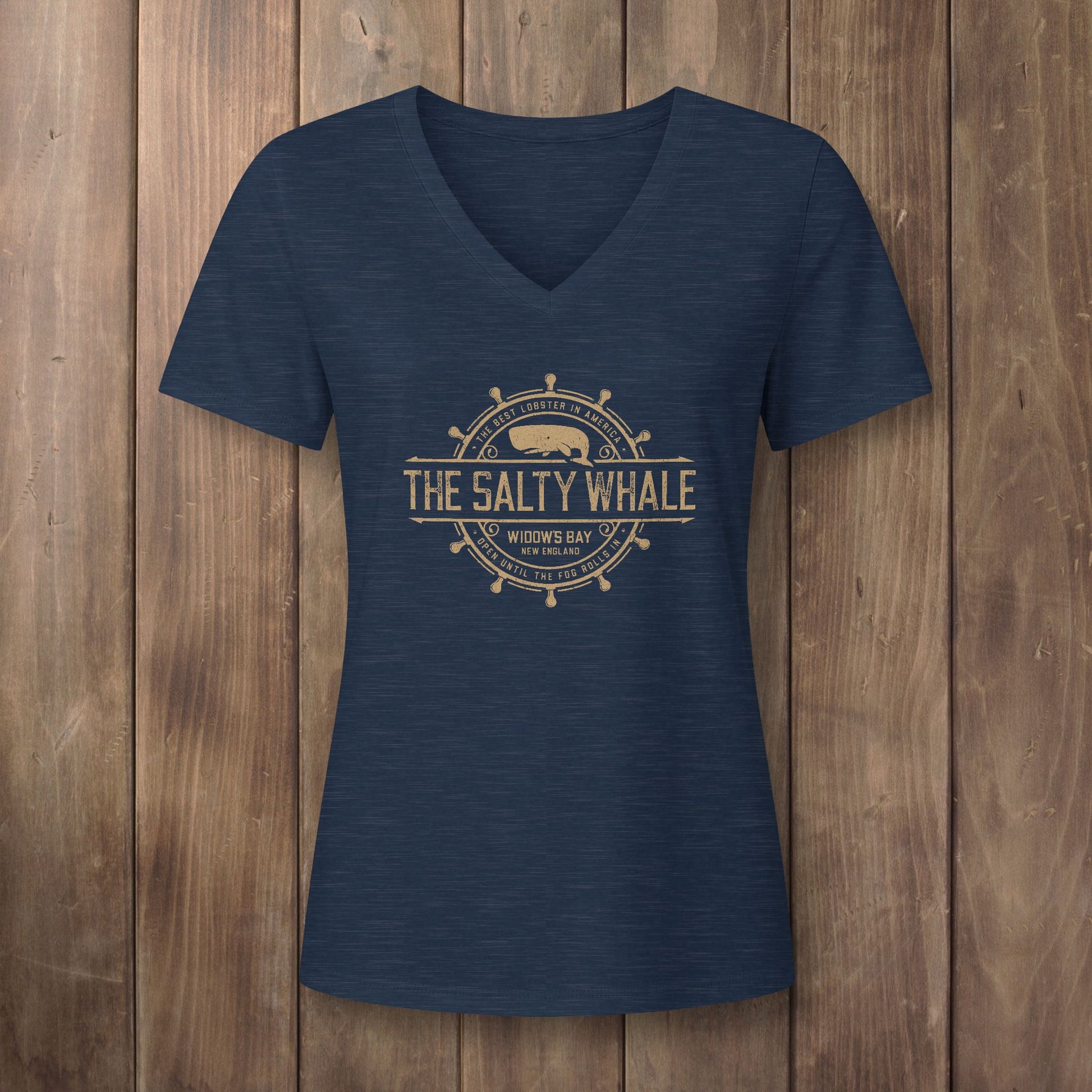 Heather navy blue womens v-neck tee with gold vintage The Salty Whale nautical crest inspired by Widow's Bay show