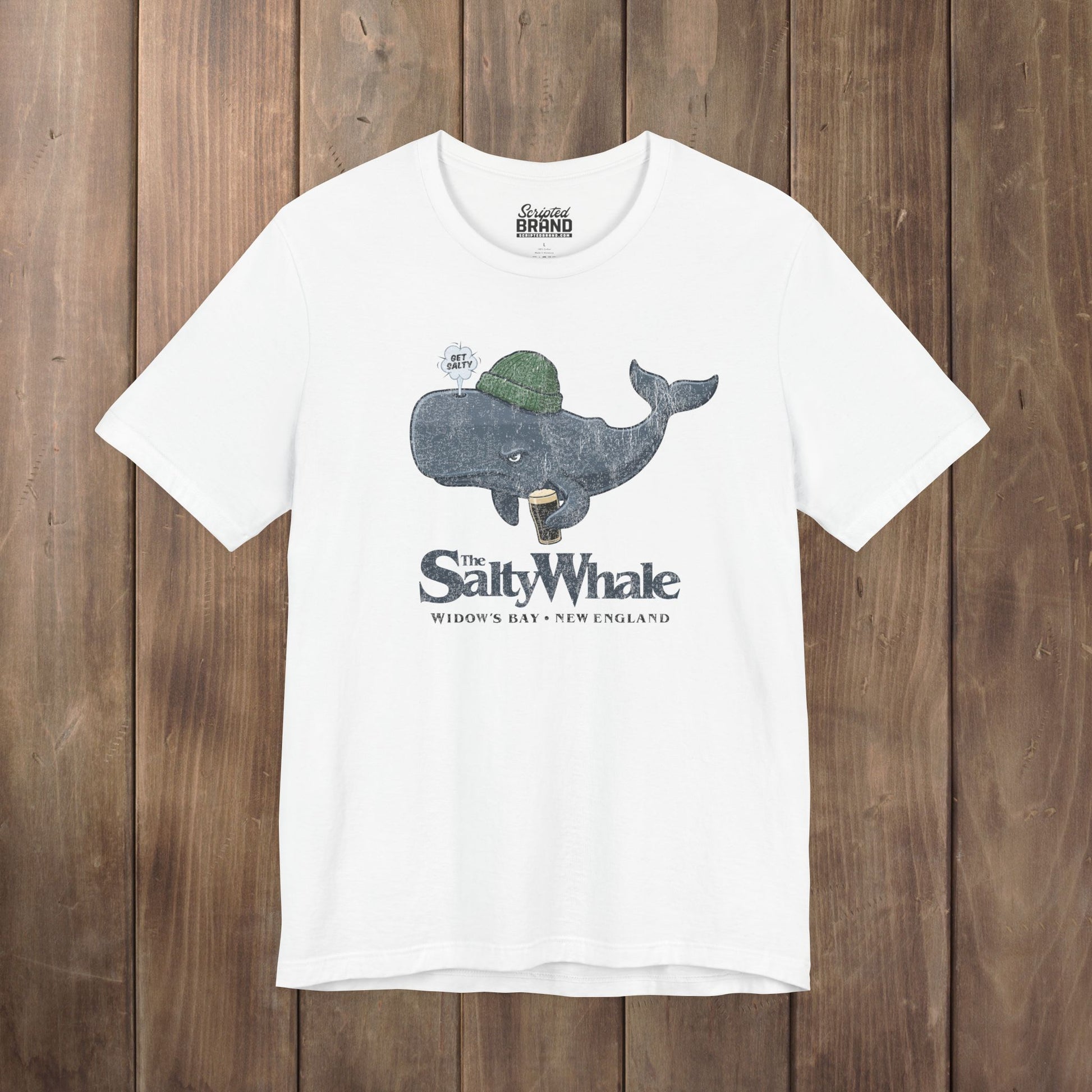 White 'The Salty Whale' cartoon mascot t-shirt inspired by Widow's Bay Apple TV series, soft Bella+Canvas cotton pub fan tee