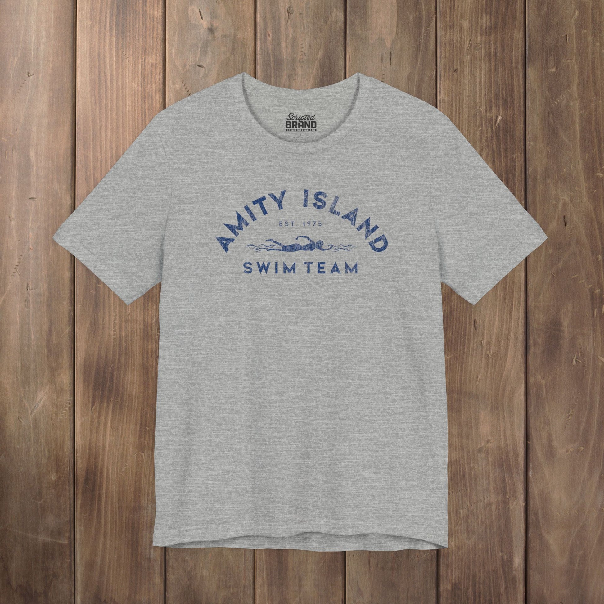 Heather gray tee with vintage distressed Amity Island Swim Team Jaws-inspired swimmer logo