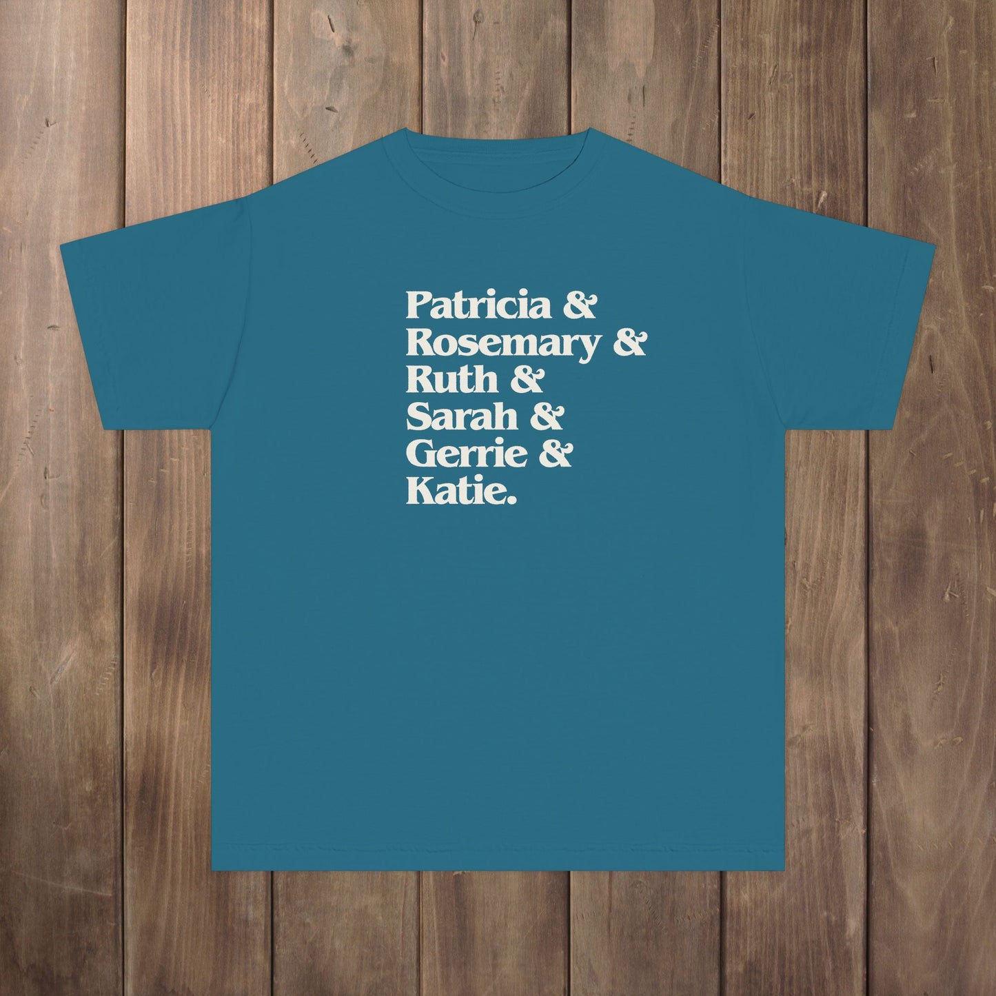 Topaz Blue slate youth kids tee with stacked Women of Widow's Bay names in cream type