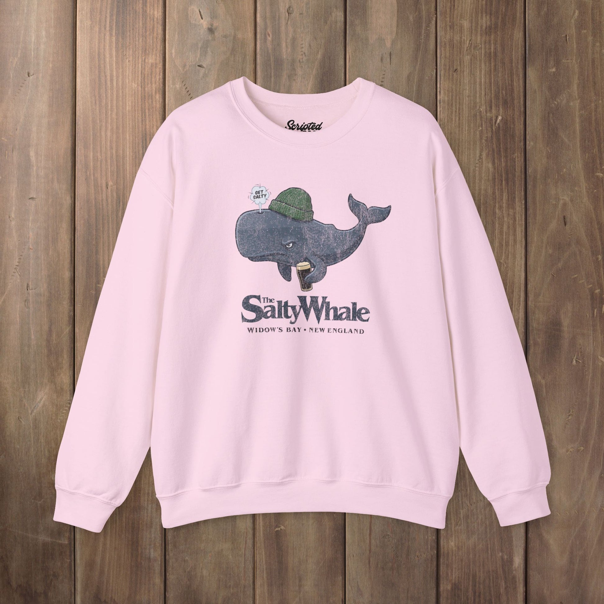 Pink colored The Salty Whale cartoon mascot crewneck sweatshirt inspired by Widow's Bay Apple TV series, vintage pub fan pullover