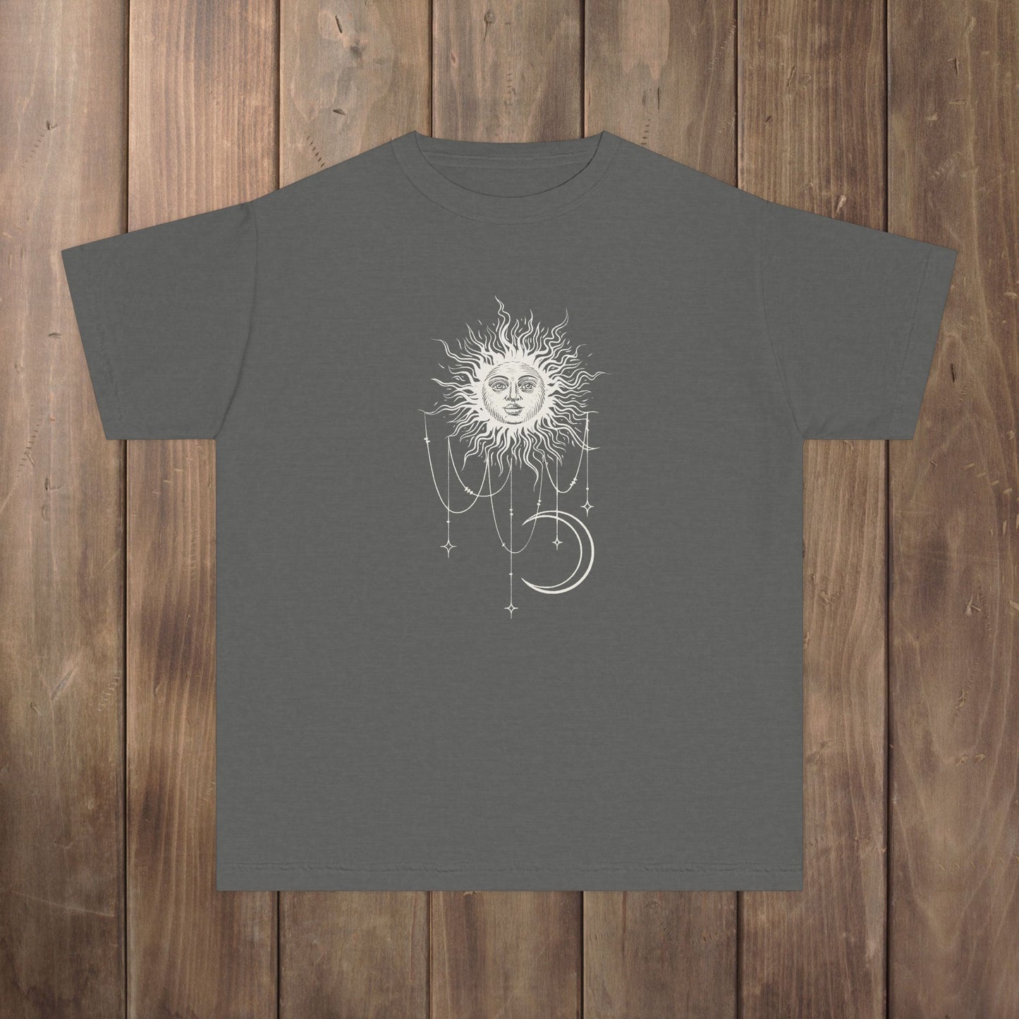 Front of pepper gray youth tee with Patricia boho celestial sun, stars, and crescent moon design from Widow's Bay