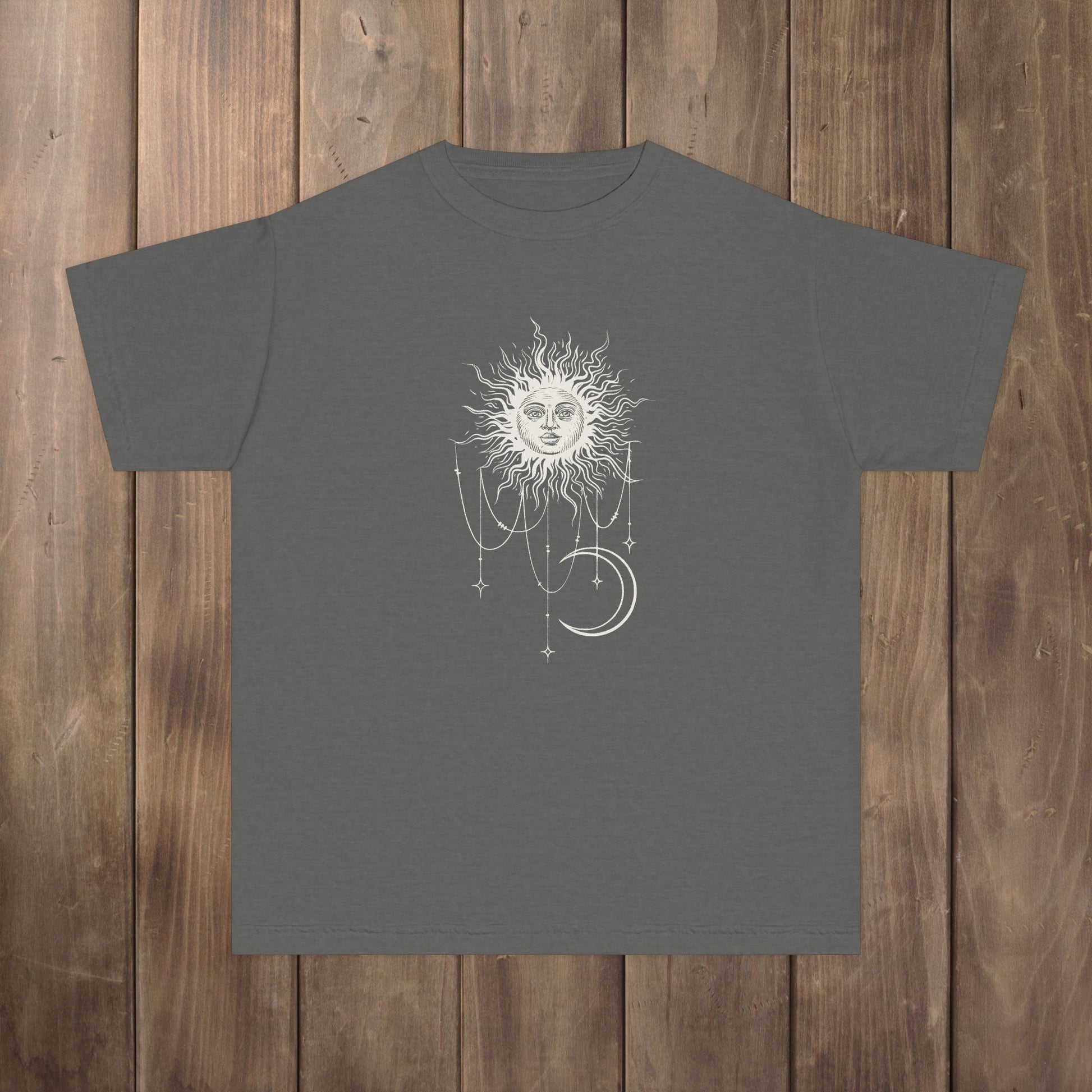 Front of pepper gray youth tee with Patricia boho celestial sun, stars, and crescent moon design from Widow's Bay
