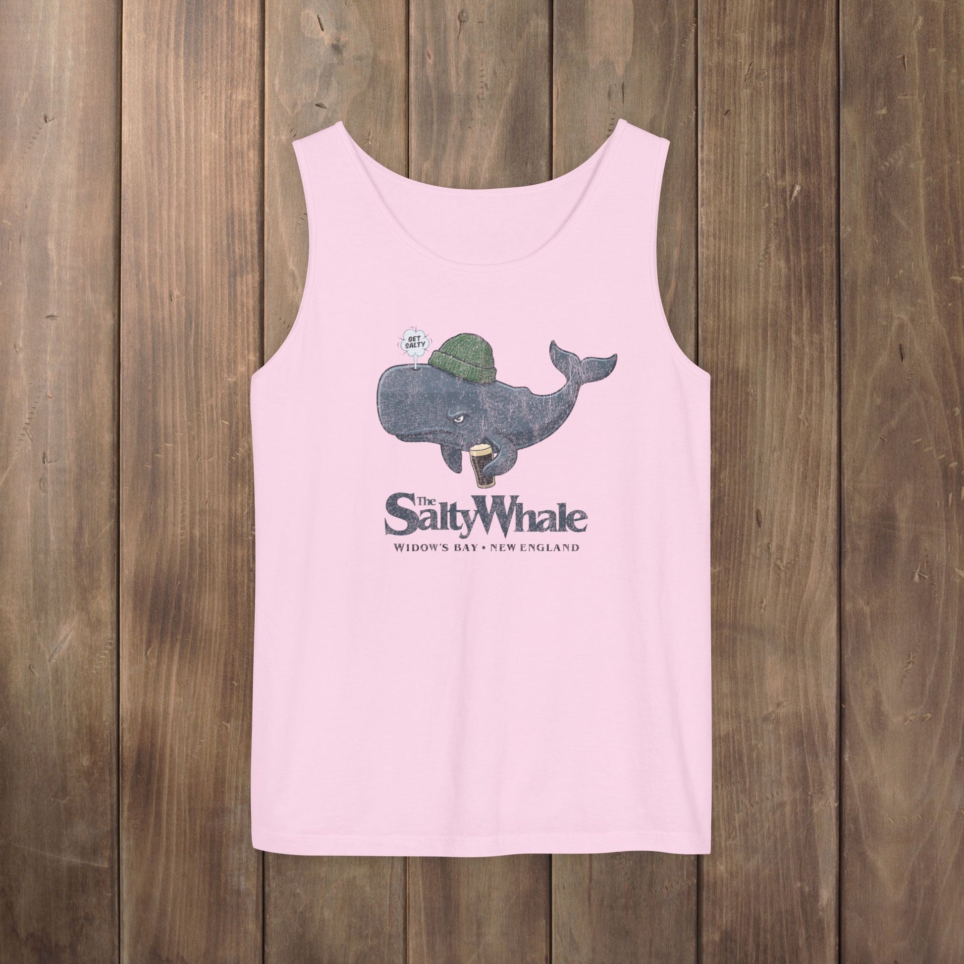 Pink Comfort Colors tank with the Salty Whale logo from Widow's Bay, a beanie-wearing cartoon whale drinking dark beer