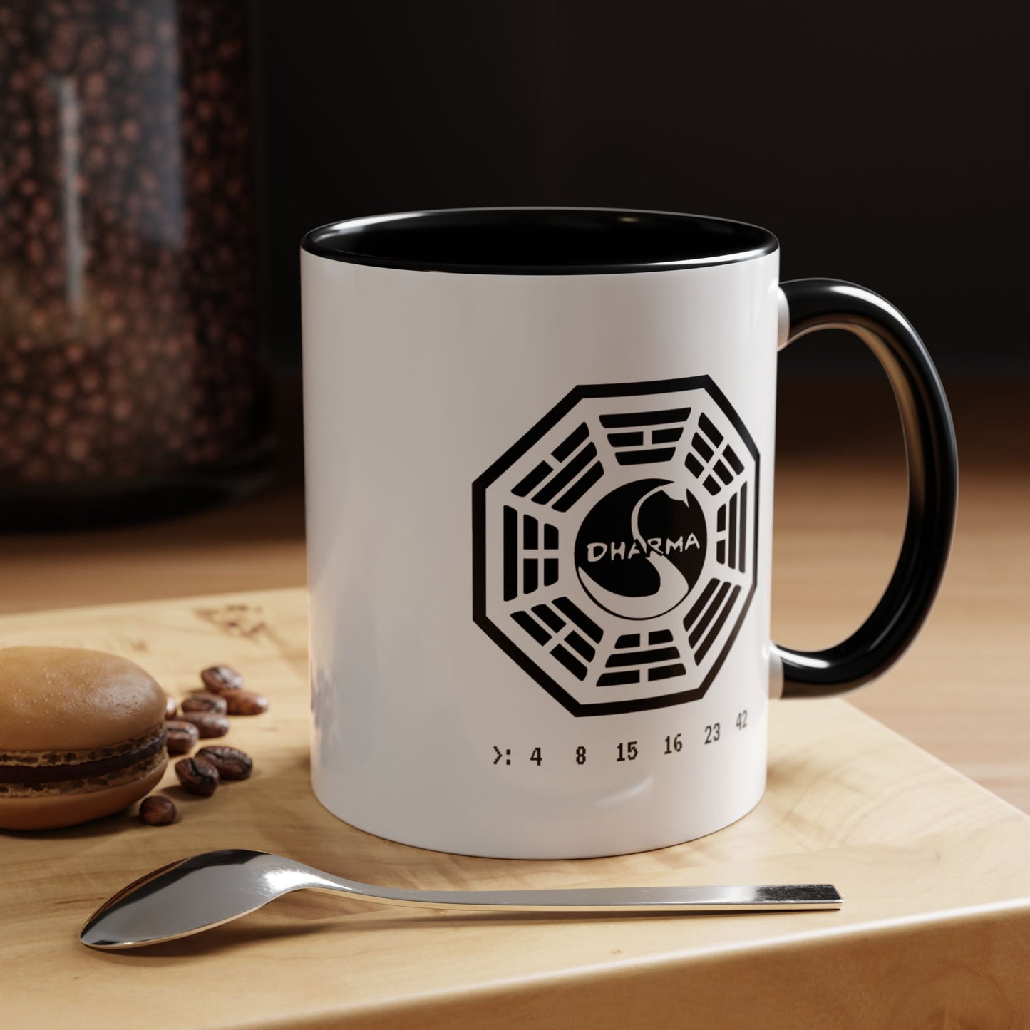 11 oz White ceramic Dharma Initiative Swan Station logo mug with black handle and interior, hatch numbers 4 8 15 16 23 42, shown in kitchen