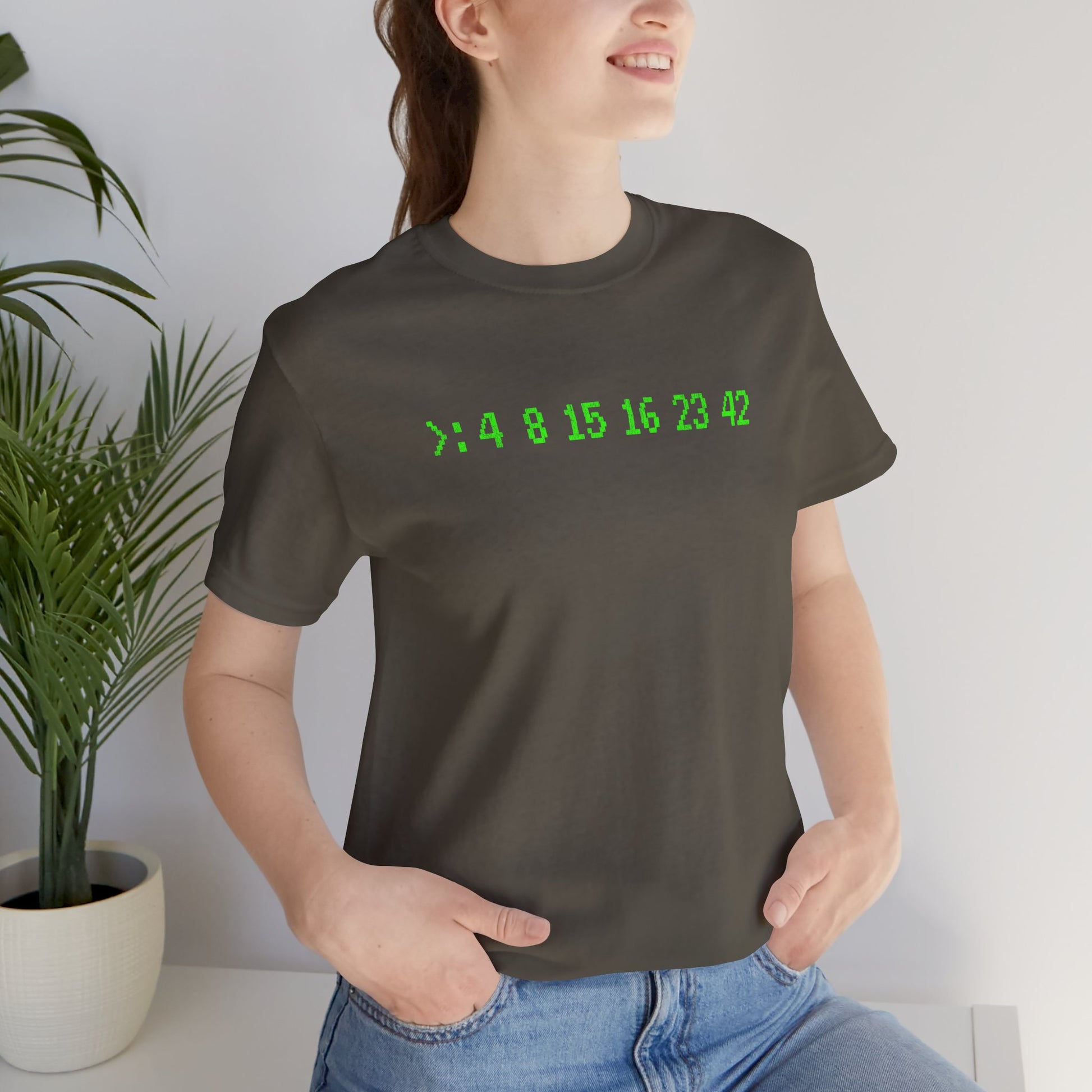 Woman wearing Army green Bella+Canvas 3001 t-shirt with terminal green LOST Dharma Initiative hatch numbers 4 8 15 16 23 42