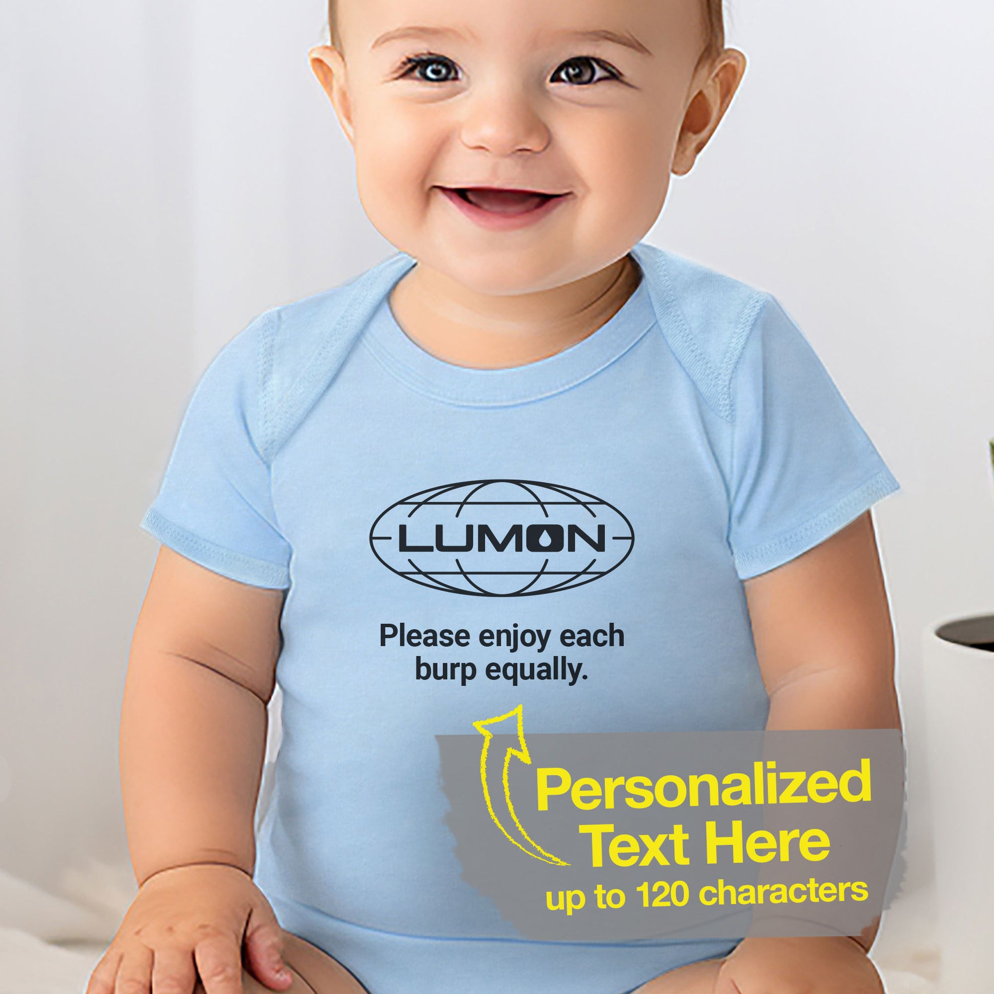 Baby boy wearing a blue Infant Fine Jersey Bodysuit Onesie for babies featuring the Lumon Industries logo and customizable text (up to 120 characters) inspired by the Apple TV show Severance. Custom text says "Please enjoy each burp equally"