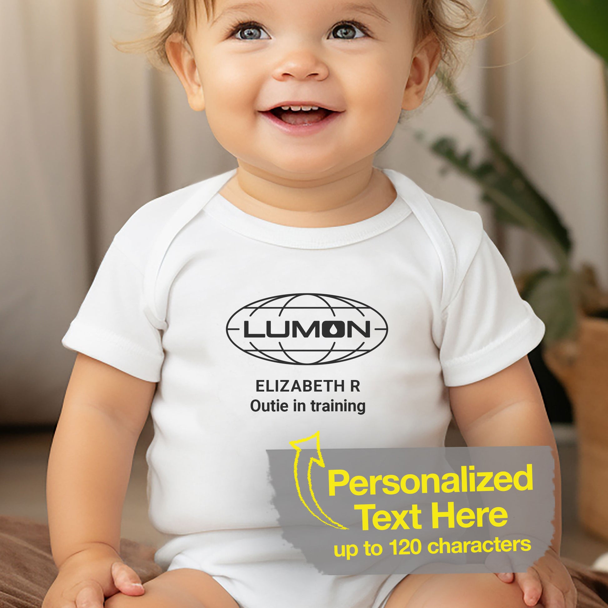 Baby girl wearing a white Infant Fine Jersey Bodysuit Onesie for babies featuring the Lumon Industries logo and customizable text (up to 120 characters) inspired by the Apple TV show Severance. Custom text says "Elizabeth R Outie in Training"