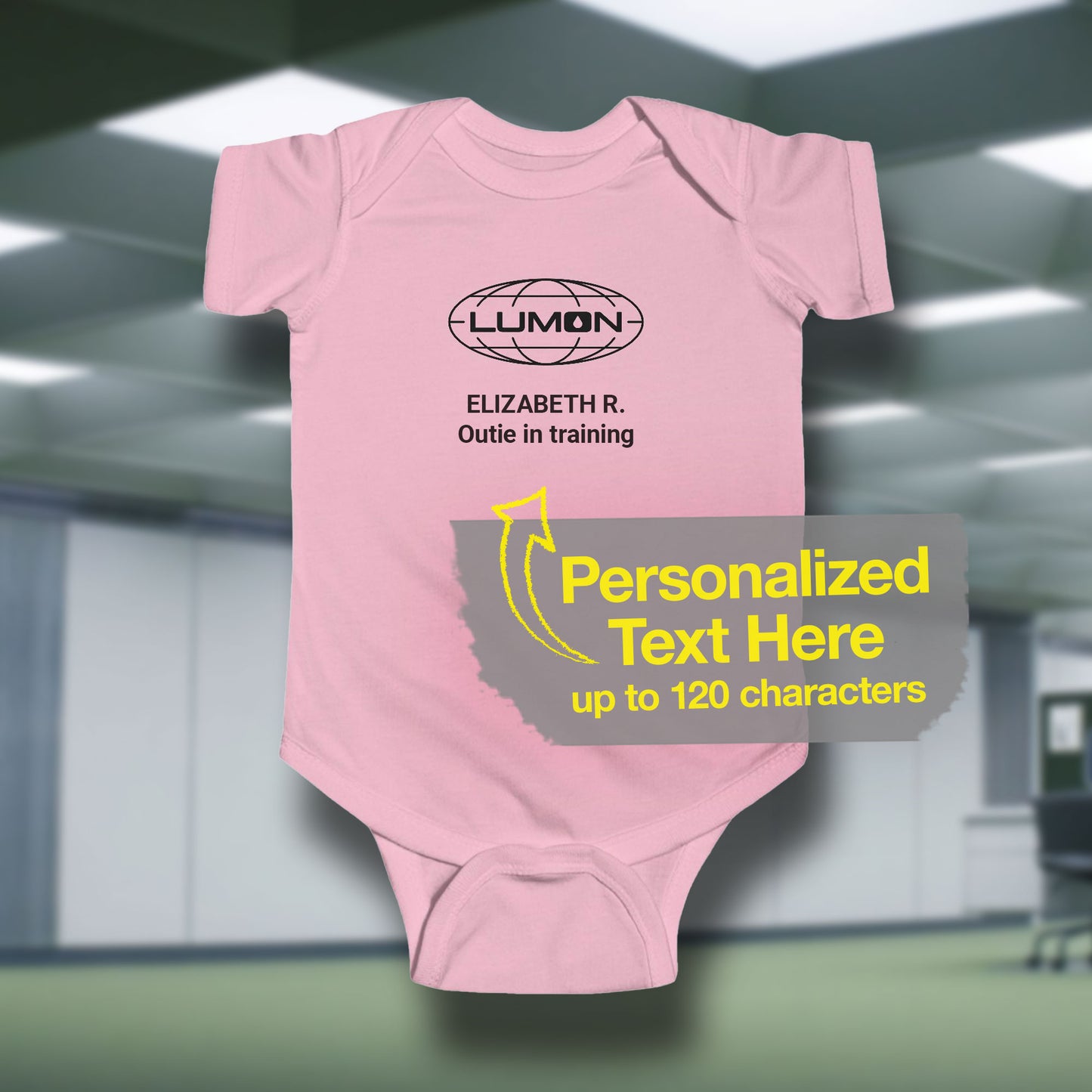 Mockup of a pink Infant Fine Jersey Bodysuit Onesie for babies featuring the Lumon Industries logo and customizable text (up to 120 characters) inspired by the Apple TV show Severance.