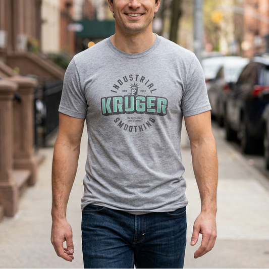 Man wearing heather gray Bella+Canvas t-shirt featuring a Kruger Industrial Smoothing logo graphic inspired by the TV show Seinfeld in a vintage distressed style.