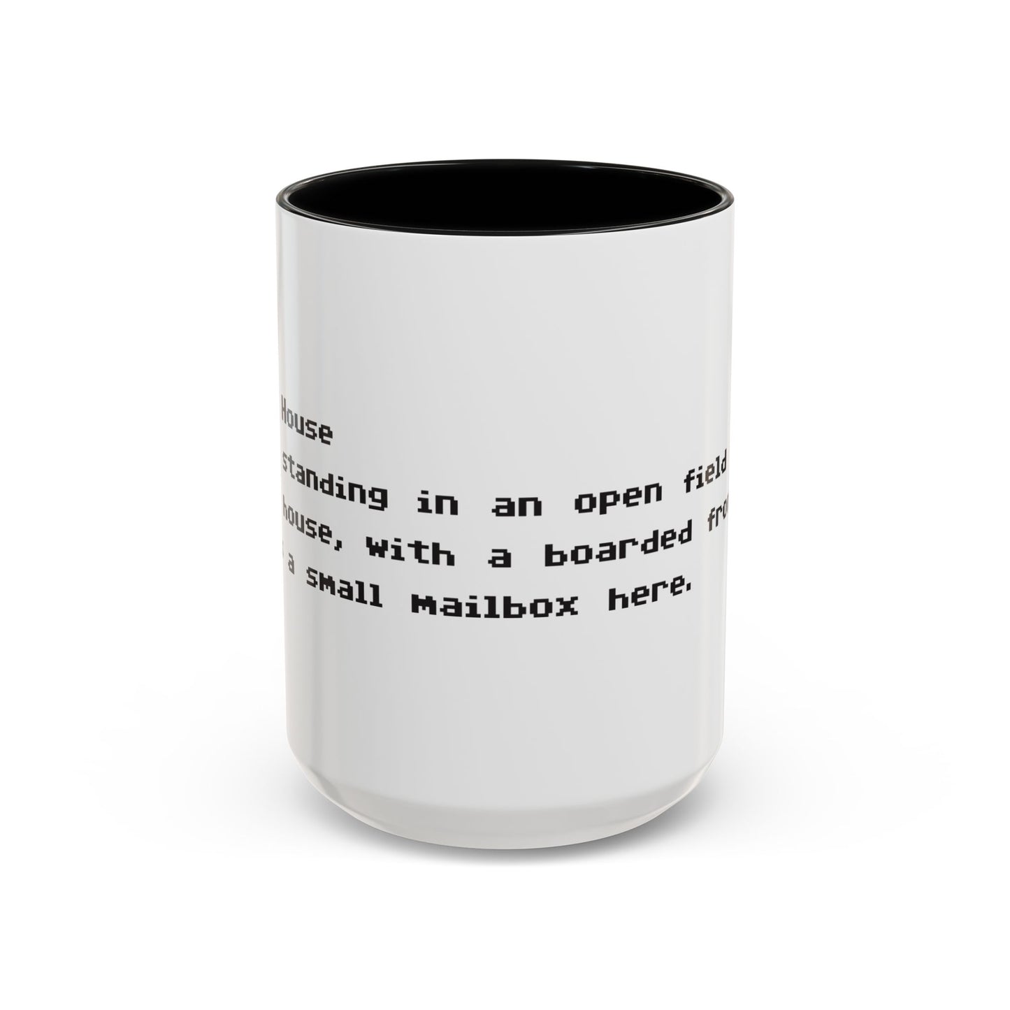 Front view of 15 oz White ceramic accent mug with black handle and interior, Zork “West of House” opening line text wrapped in black print