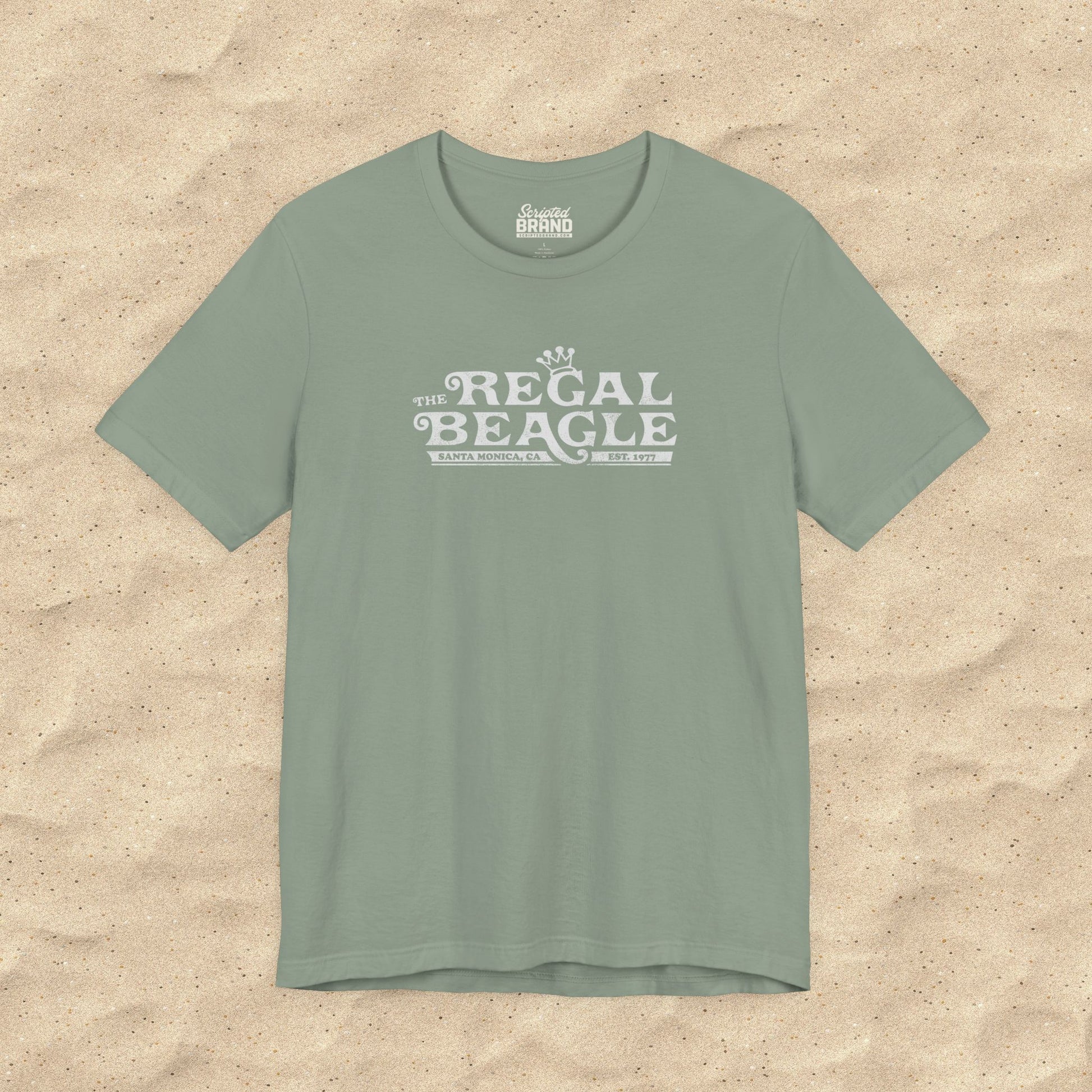 Sage green Bella+Canvas t-shirt with the Regal Beagle logo from the TV Show 'Threes Company' in a vintage distressed style.