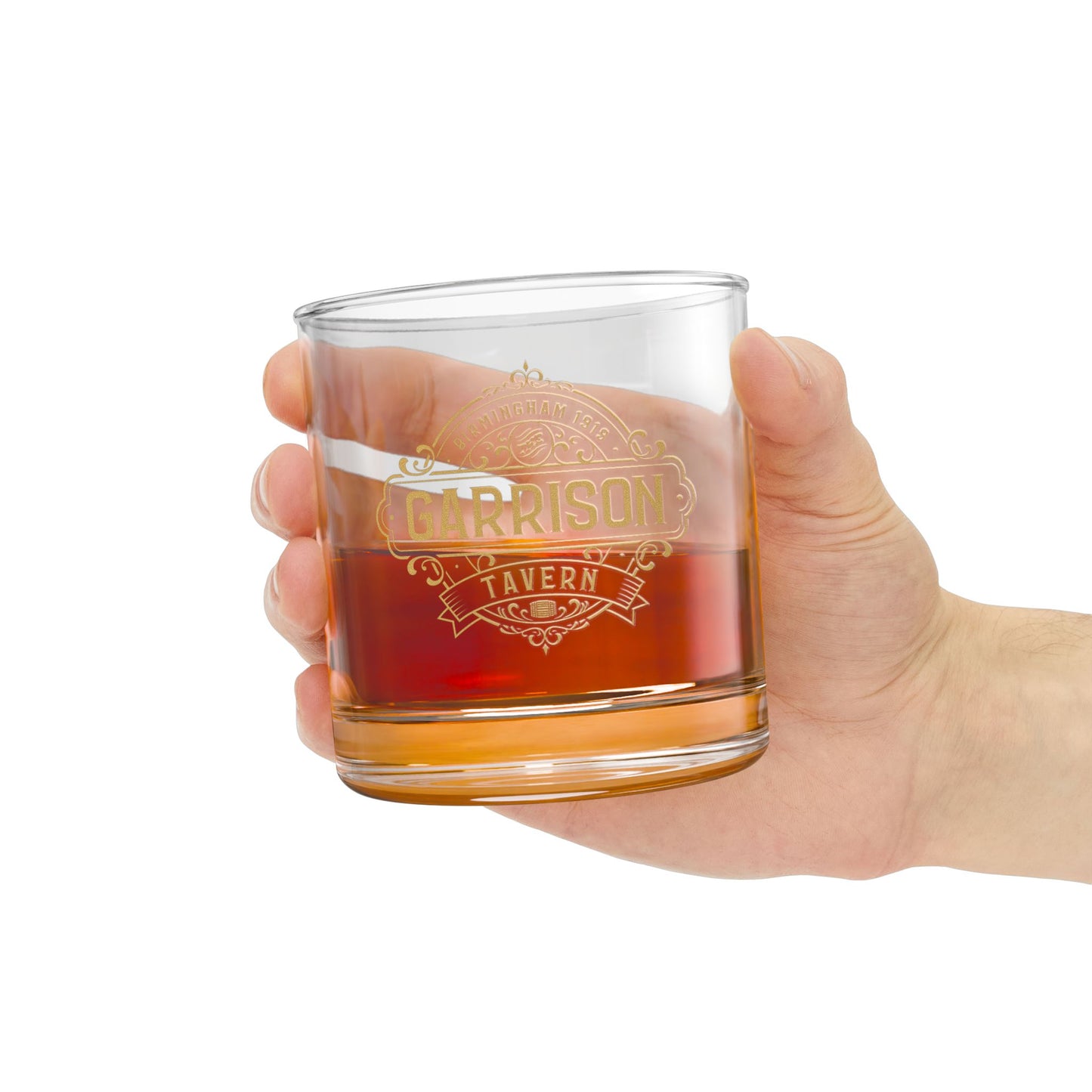 Hand holding a Garrison Tavern rocks glass with gold Birmingham 1919 logo, inspired by Peaky Blinders, 10oz whiskey lowball glass.