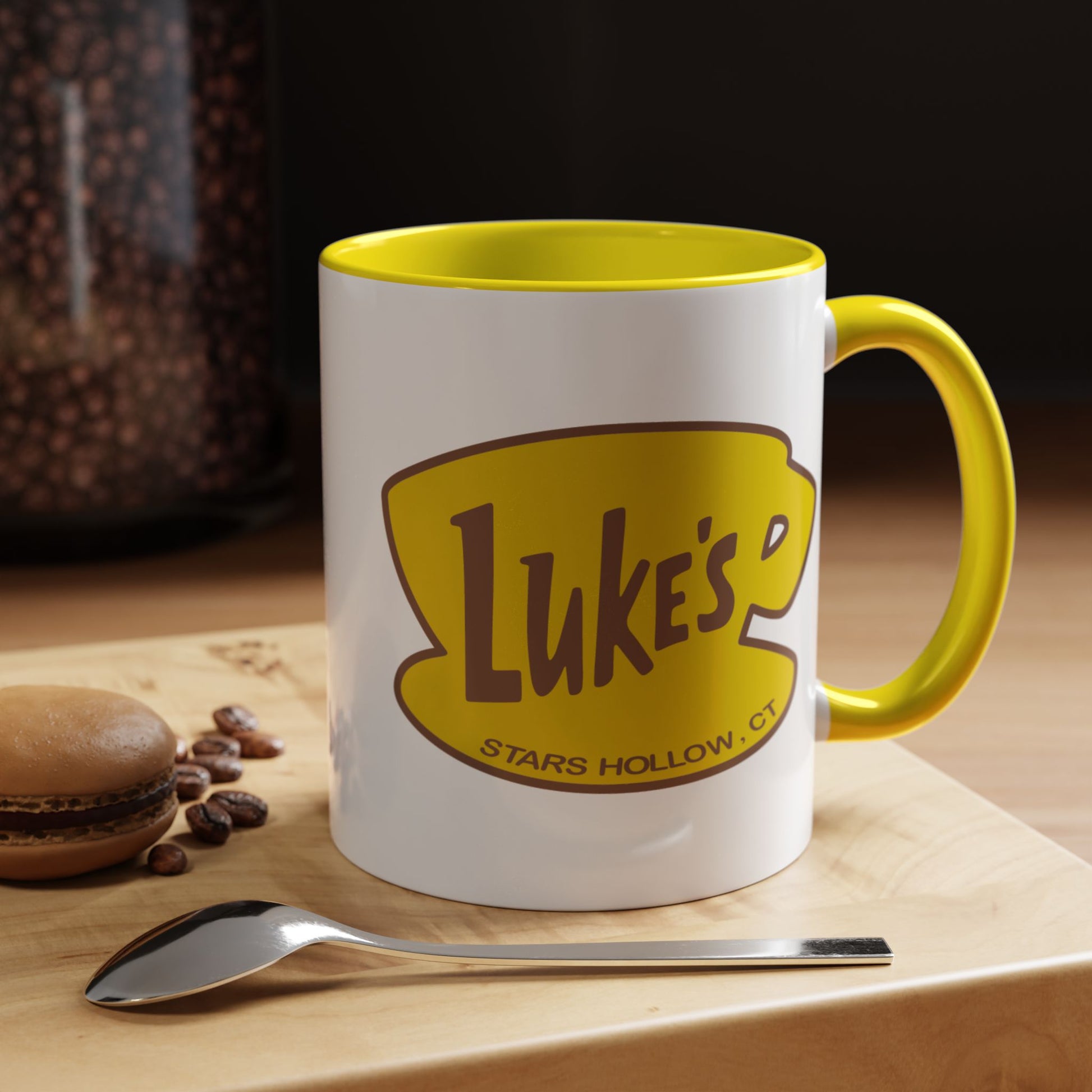 Kitchen view of 11 oz White ceramic mug with yellow handle and Luke’s Diner logo from Gilmore Girls printed on both sides.