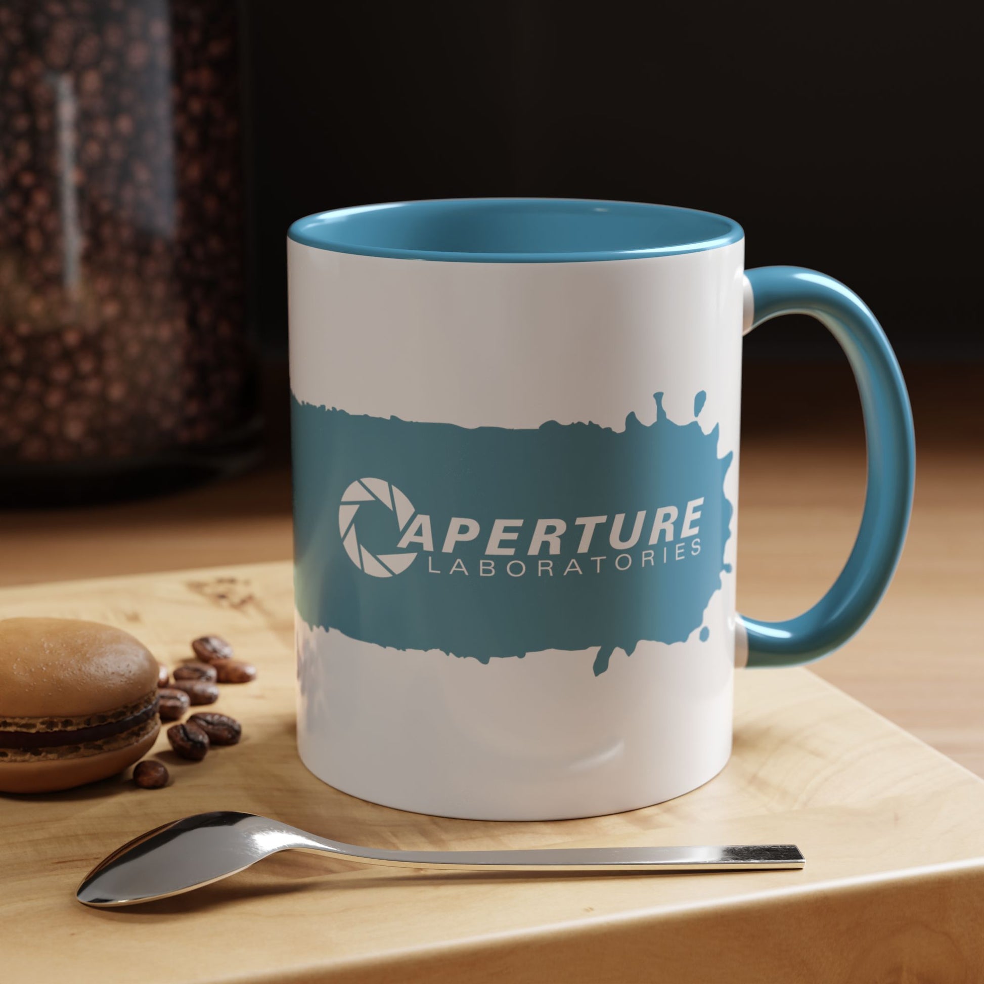 Kitchen view of 11oz Portal 2 Aperture Laboratories blue Repulsion Gel accent mug with blue handle, glossy ceramic.