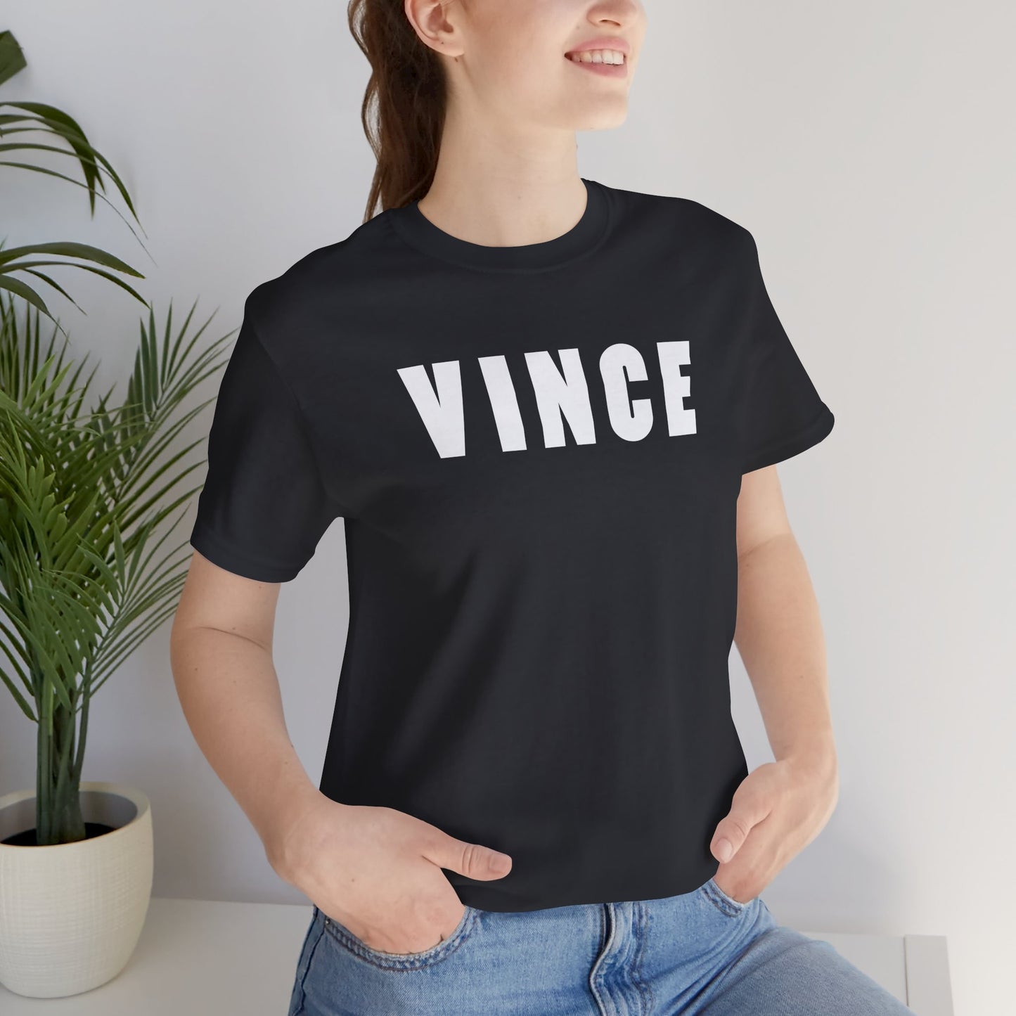 Woman wearing Black VINCE graphic t-shirt inspired by Tom Cruise in The Color of Money, soft Bella+Canvas cotton 80s movie tee