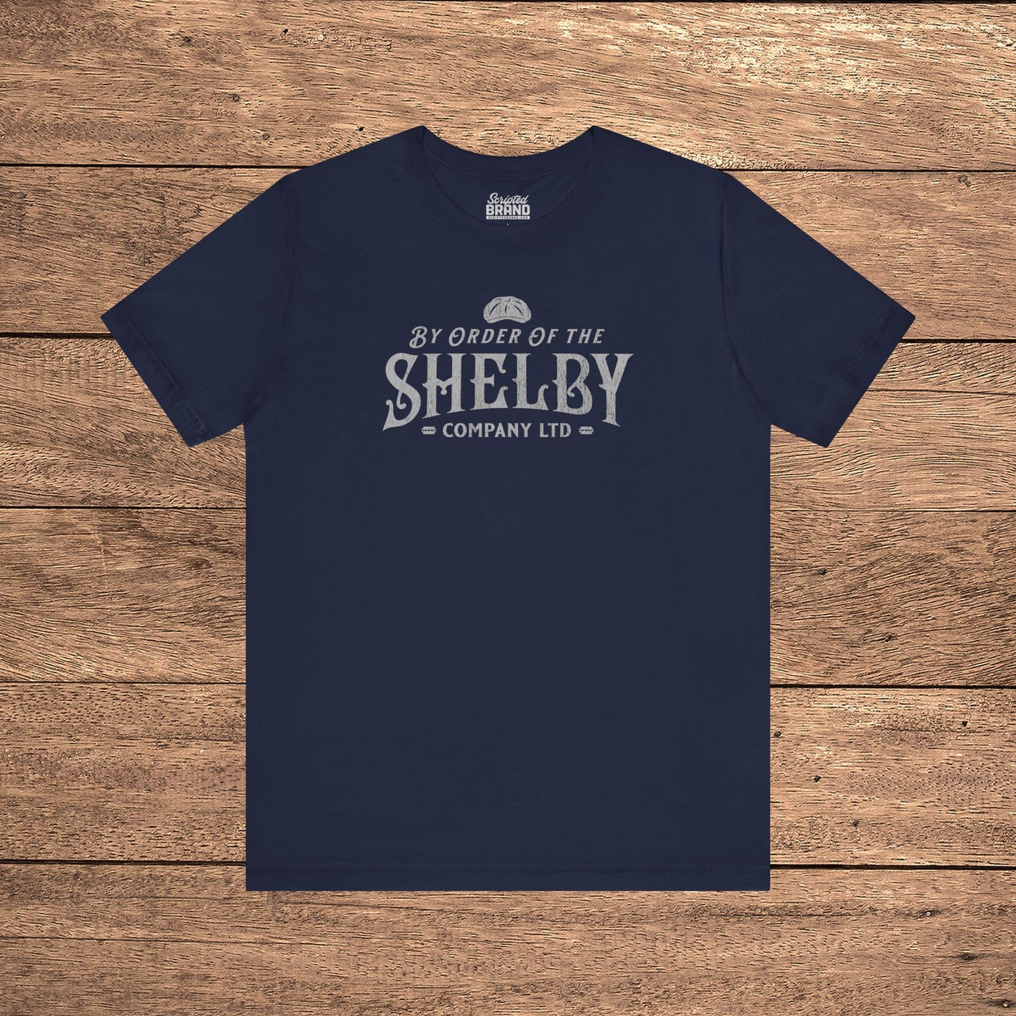 Navy blue Bella+Canvas 3001 t-shirt featuring a Shelby Company Limited logo graphic from Peaky Blinders.