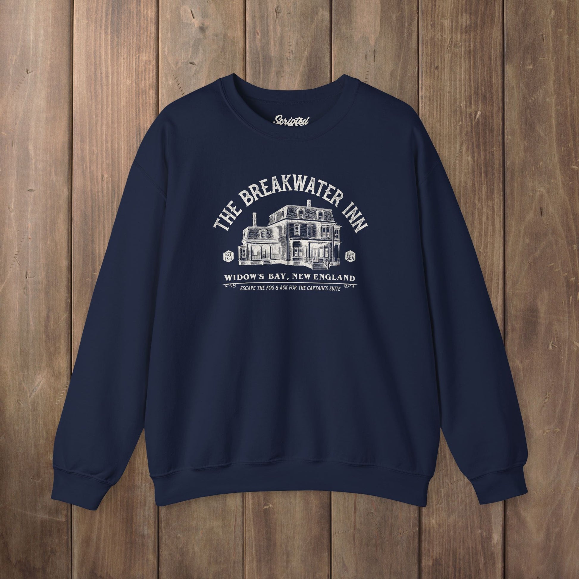 Navy blue crewneck sweatshirt with Breakwater Inn Widow's Bay New England hotel graphic