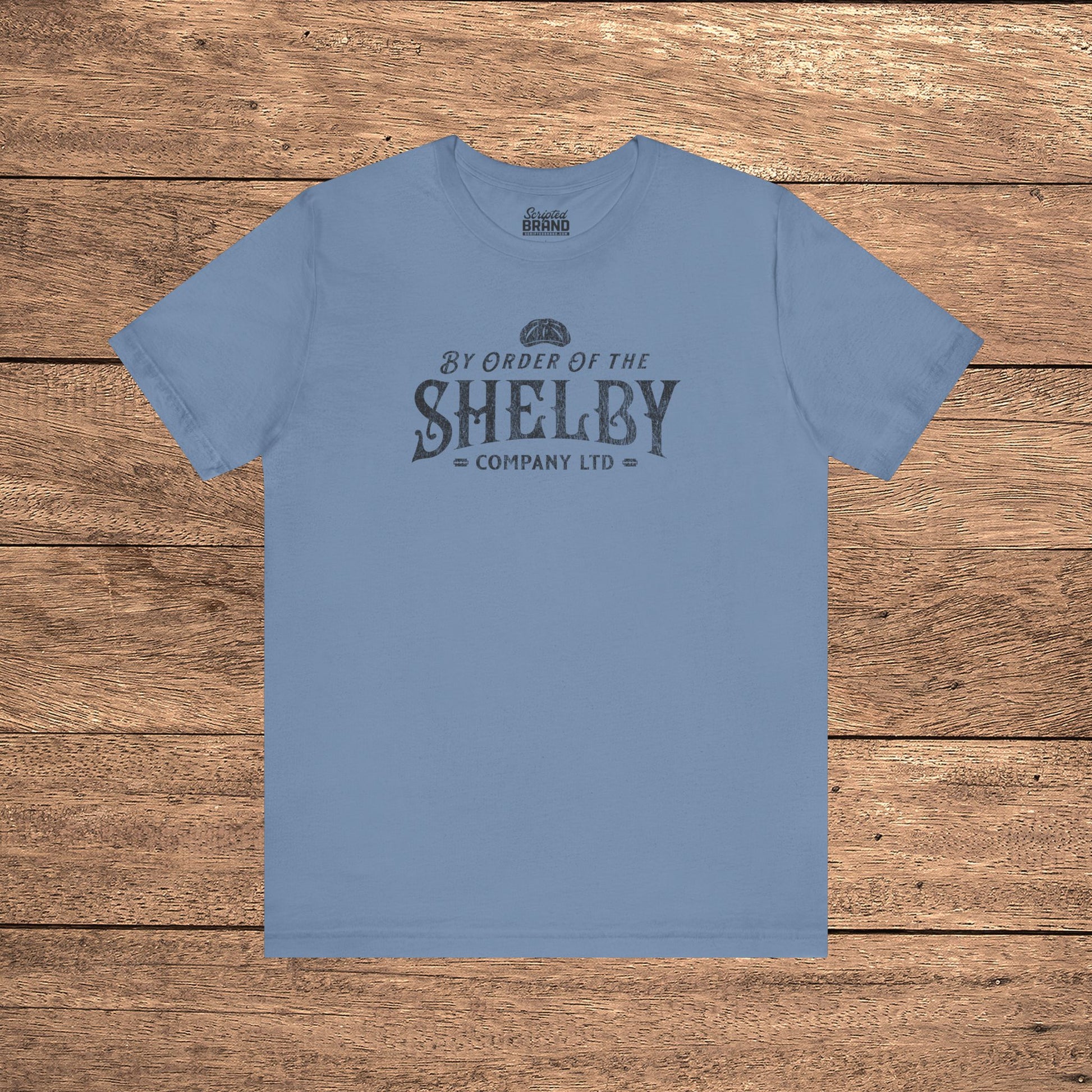 Steel blue Bella+Canvas 3001 t-shirt featuring a Shelby Company Limited logo graphic from Peaky Blinders.