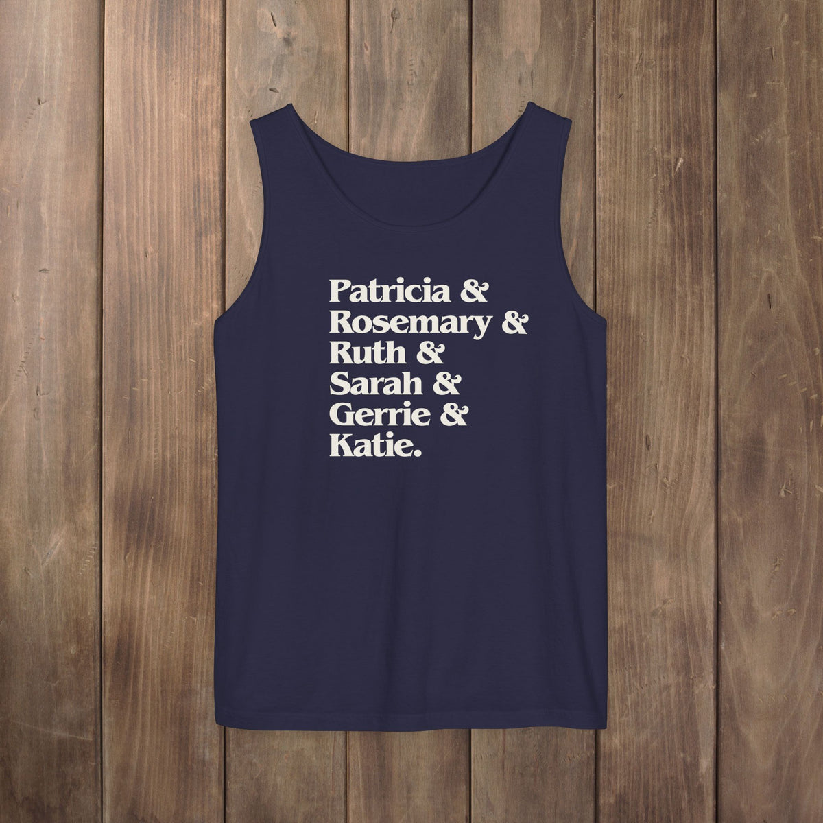 Navy blue garment-dyed Comfort Colors tank top with stacked Women of Widow's Bay show names in ampersand list including Patricia, Ruth, Rosemary