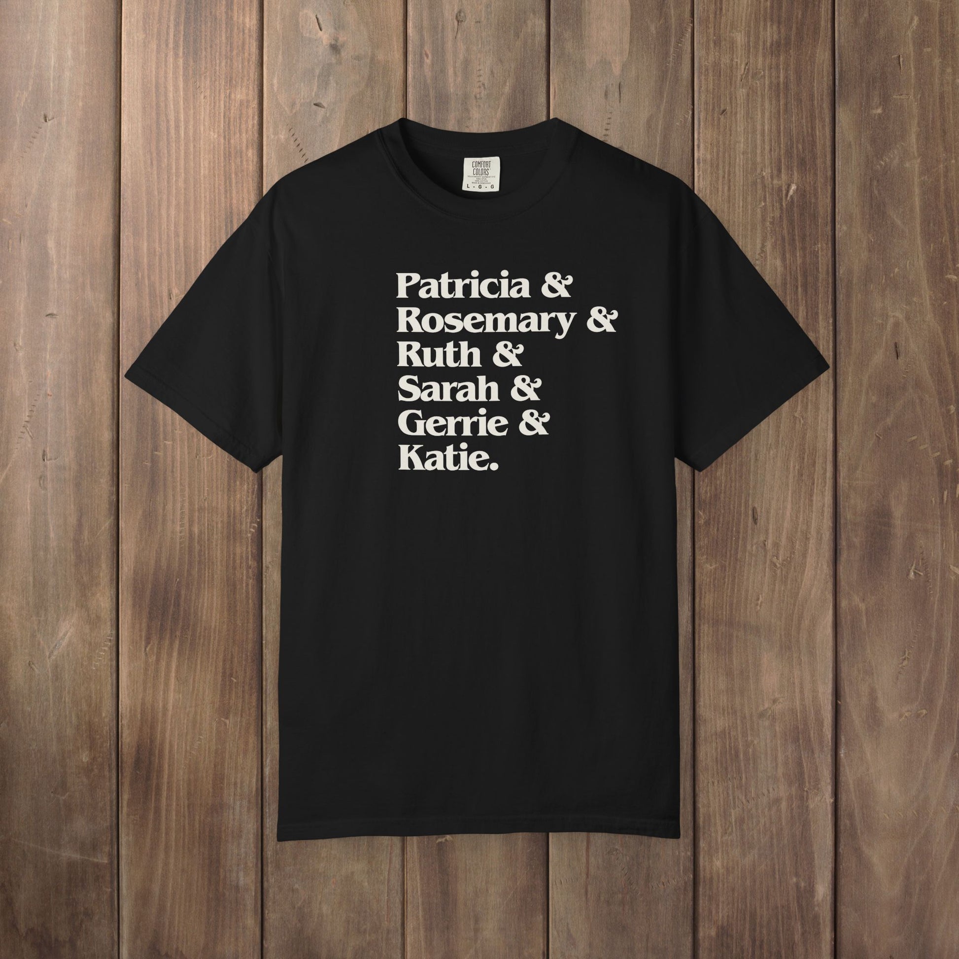 Black Comfort Colors tee listing the women of Widow's Bay: Patricia, Rosemary, Ruth, Sarah, Gerrie, and Katie