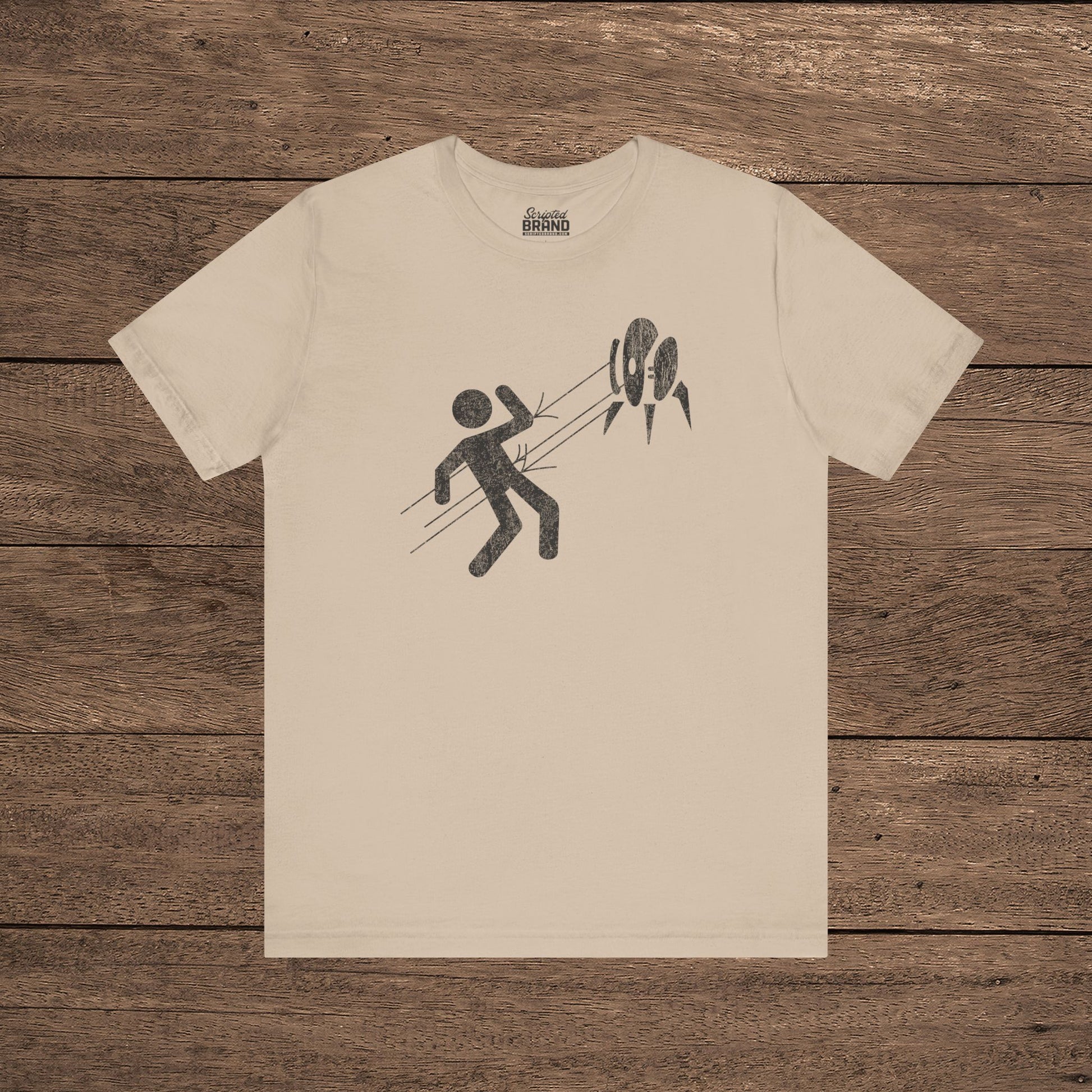 Tan Aperture Science Turret warning icon t-shirt on Bella+Canvas 3001, vintage distressed print, Portal and Portal 2 fan tee.