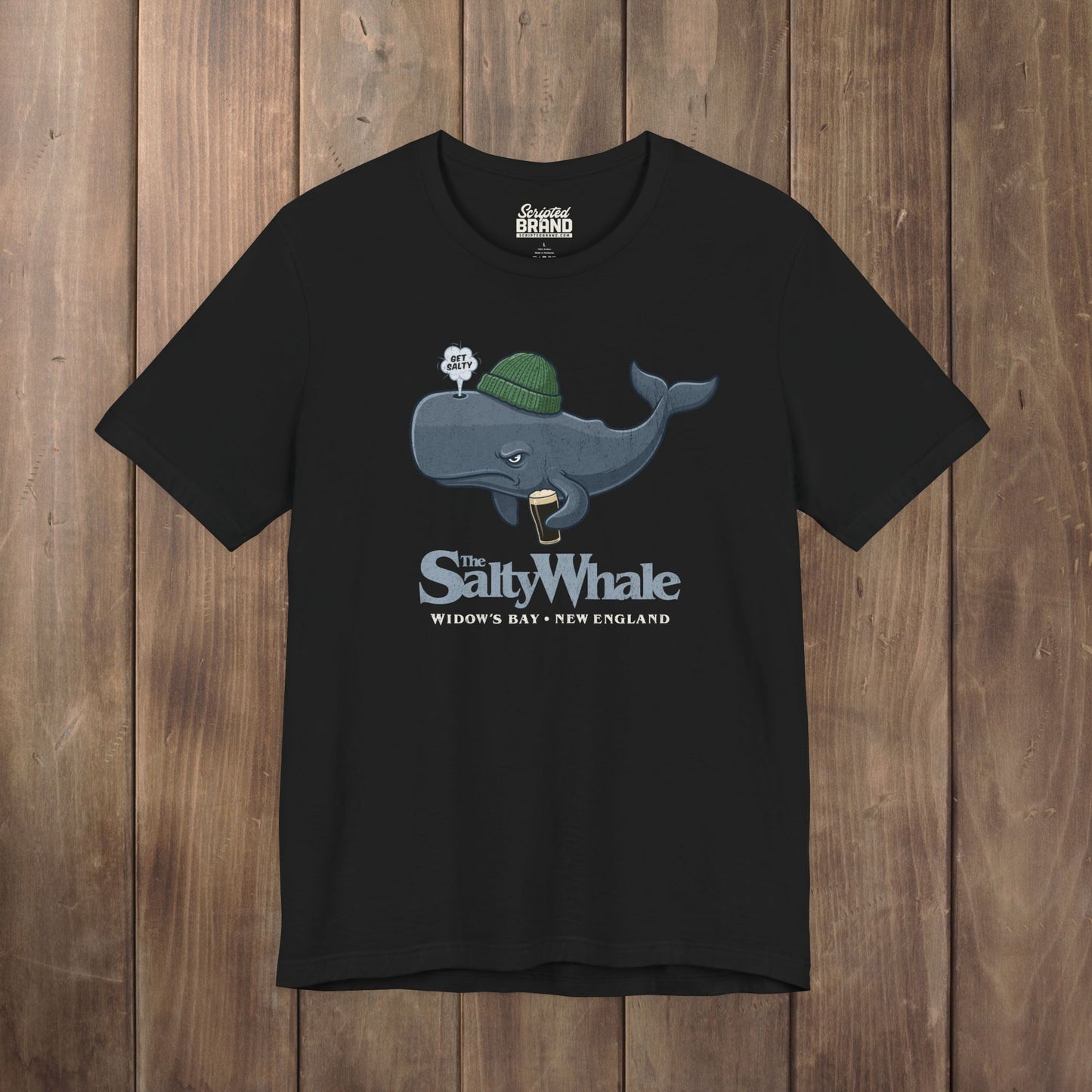 Black 'The Salty Whale' cartoon mascot t-shirt inspired by Widow's Bay Apple TV series, soft Bella+Canvas cotton pub fan tee