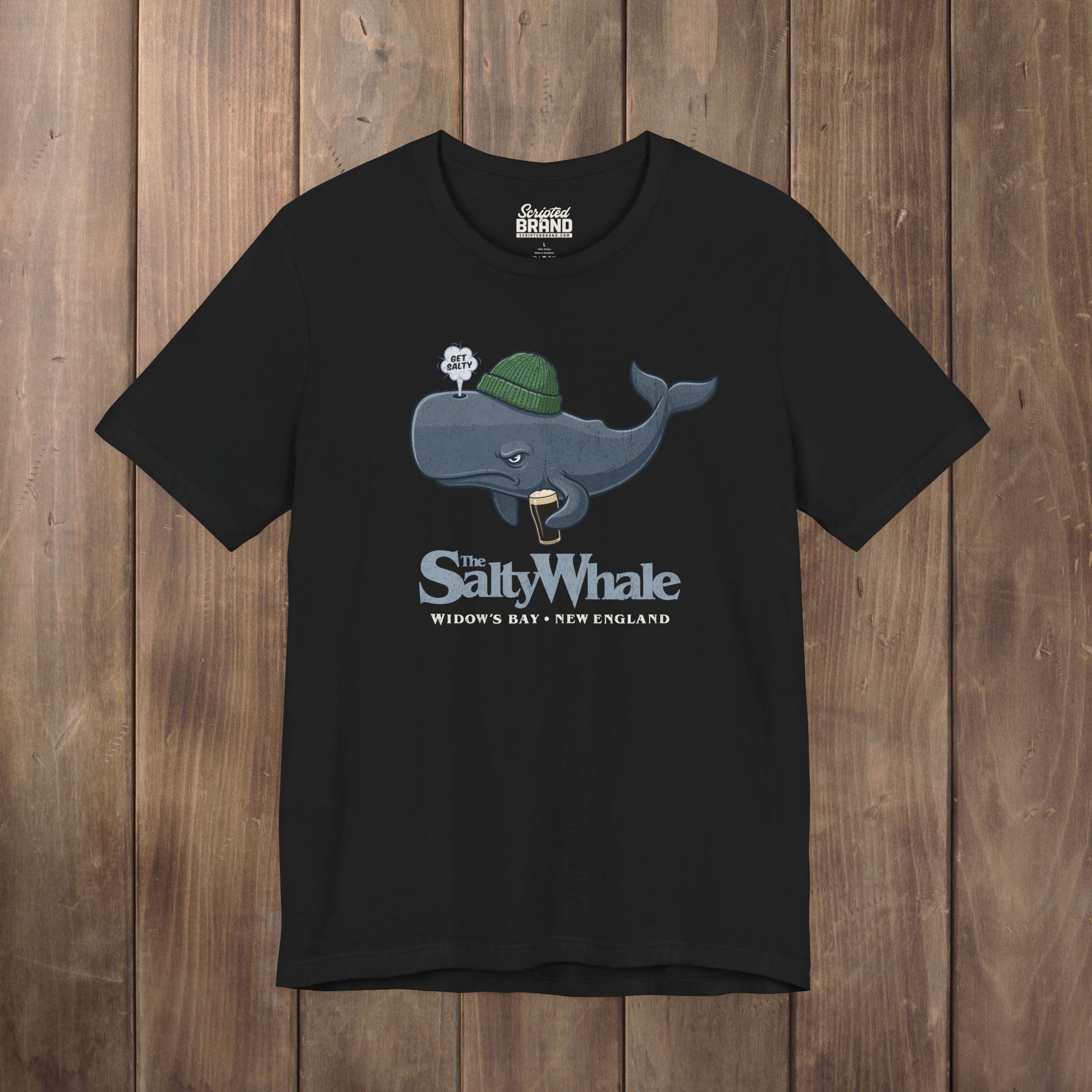Black 'The Salty Whale' cartoon mascot t-shirt inspired by Widow's Bay Apple TV series, soft Bella+Canvas cotton pub fan tee
