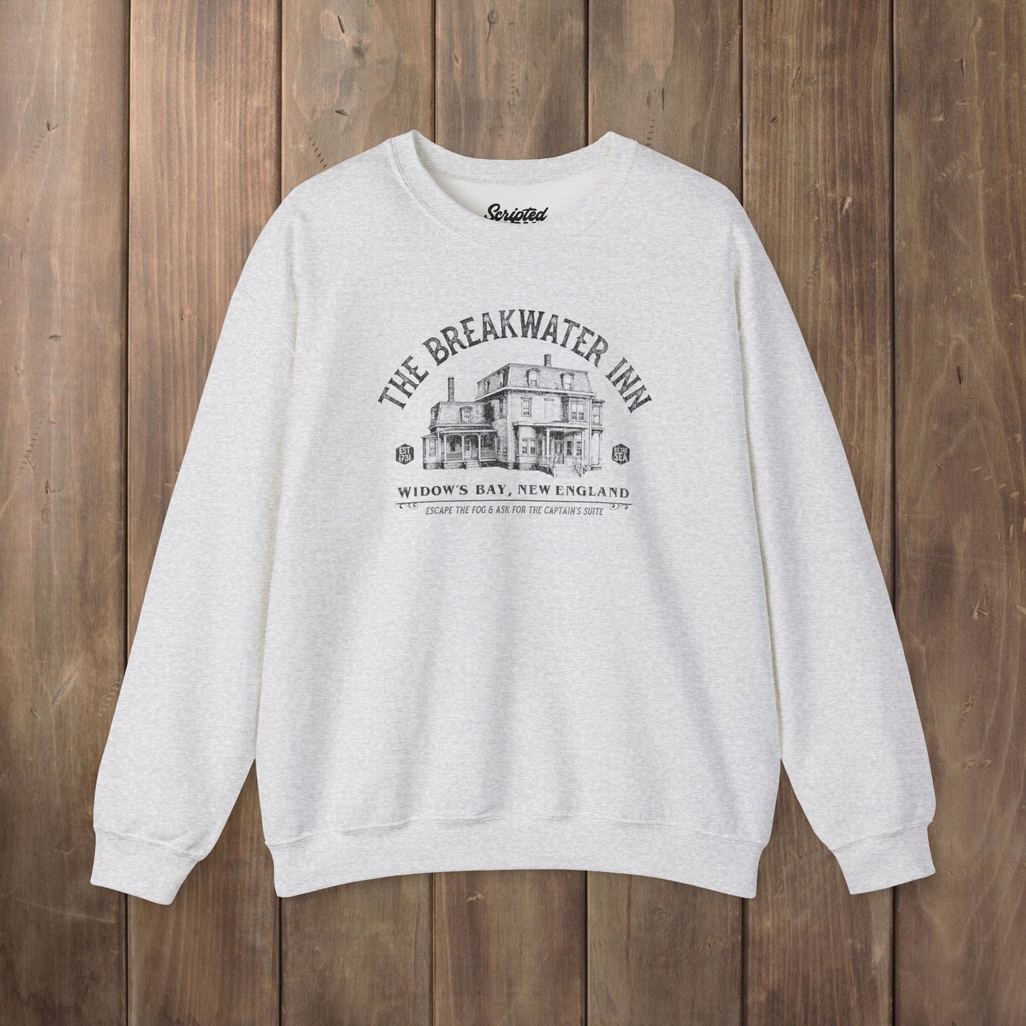 Ash crewneck sweatshirt with Breakwater Inn Widow's Bay New England hotel graphic