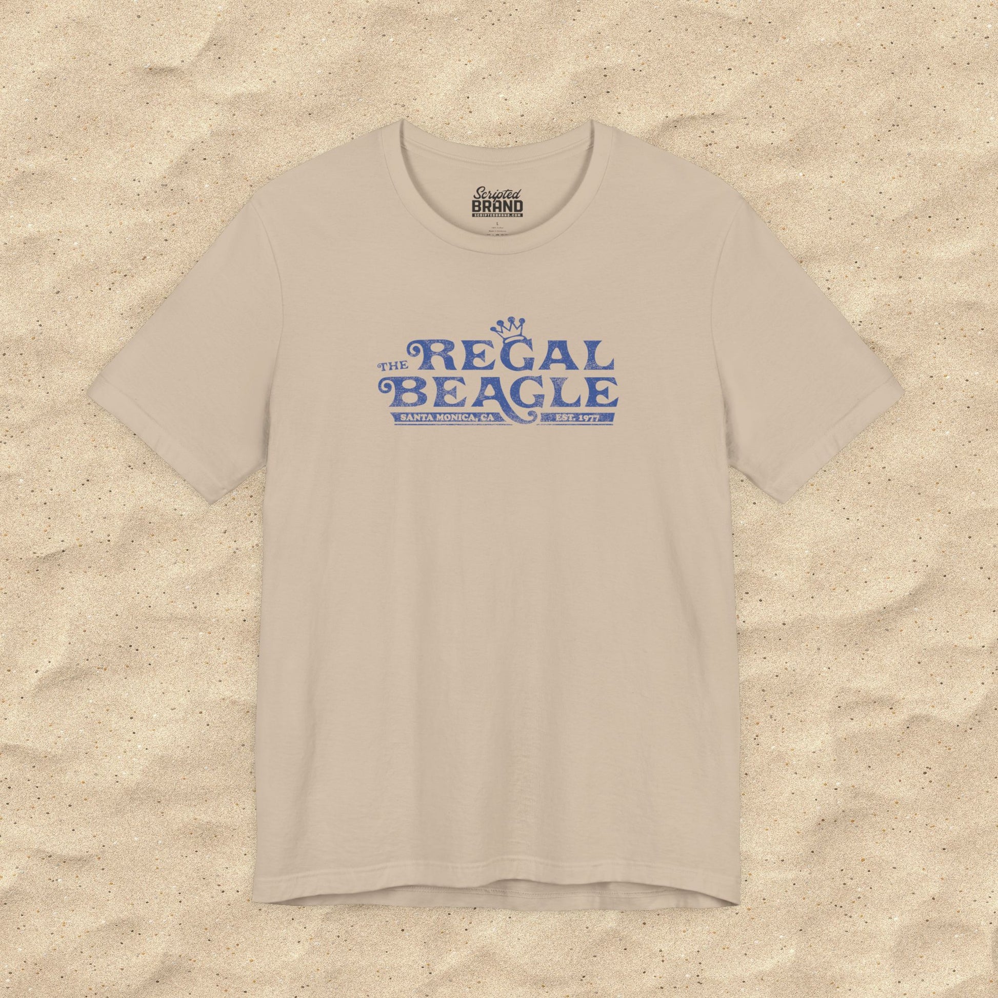 Tan Bella+Canvas t-shirt with the Regal Beagle logo from the TV Show 'Threes Company' in a vintage distressed style.