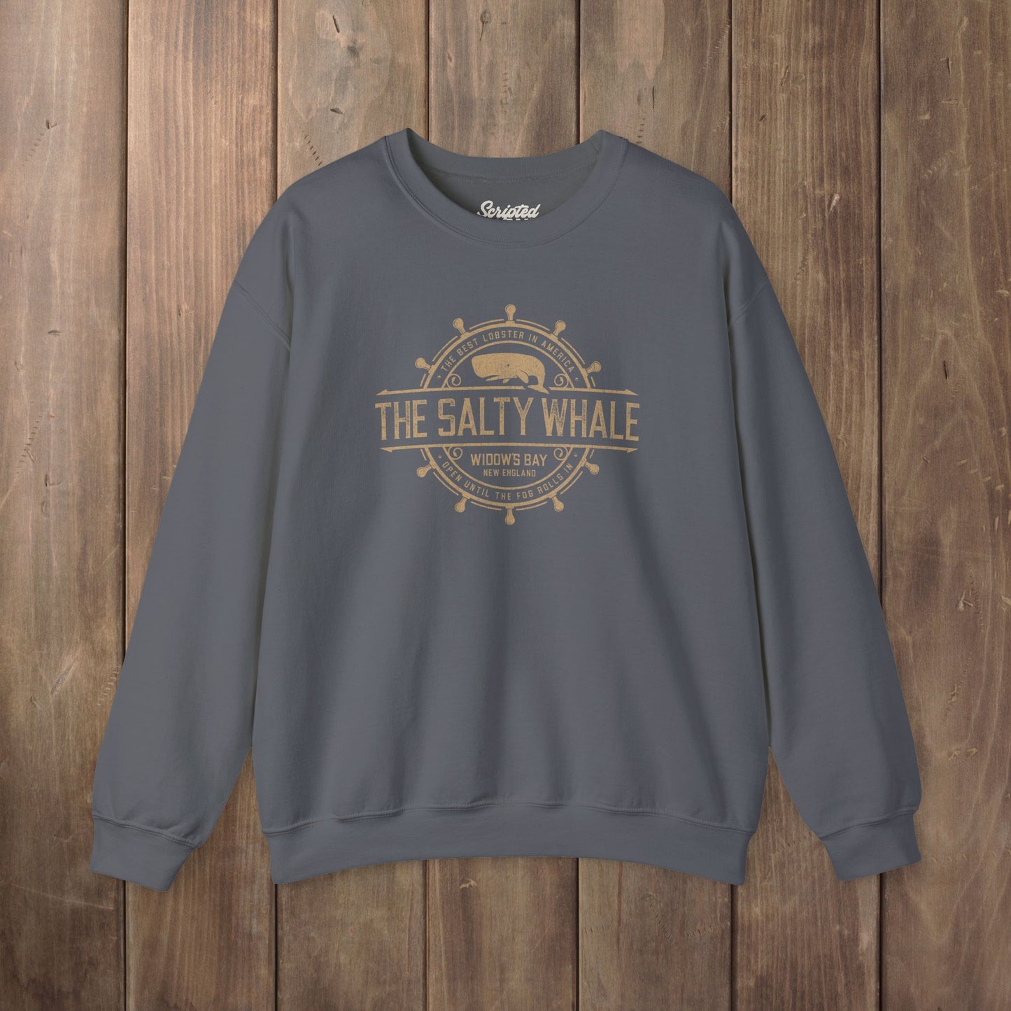 Charcoal grey Gildan crewneck sweatshirt with the distressed Salty Whale maritime crest logo from TV show Widow's Bay