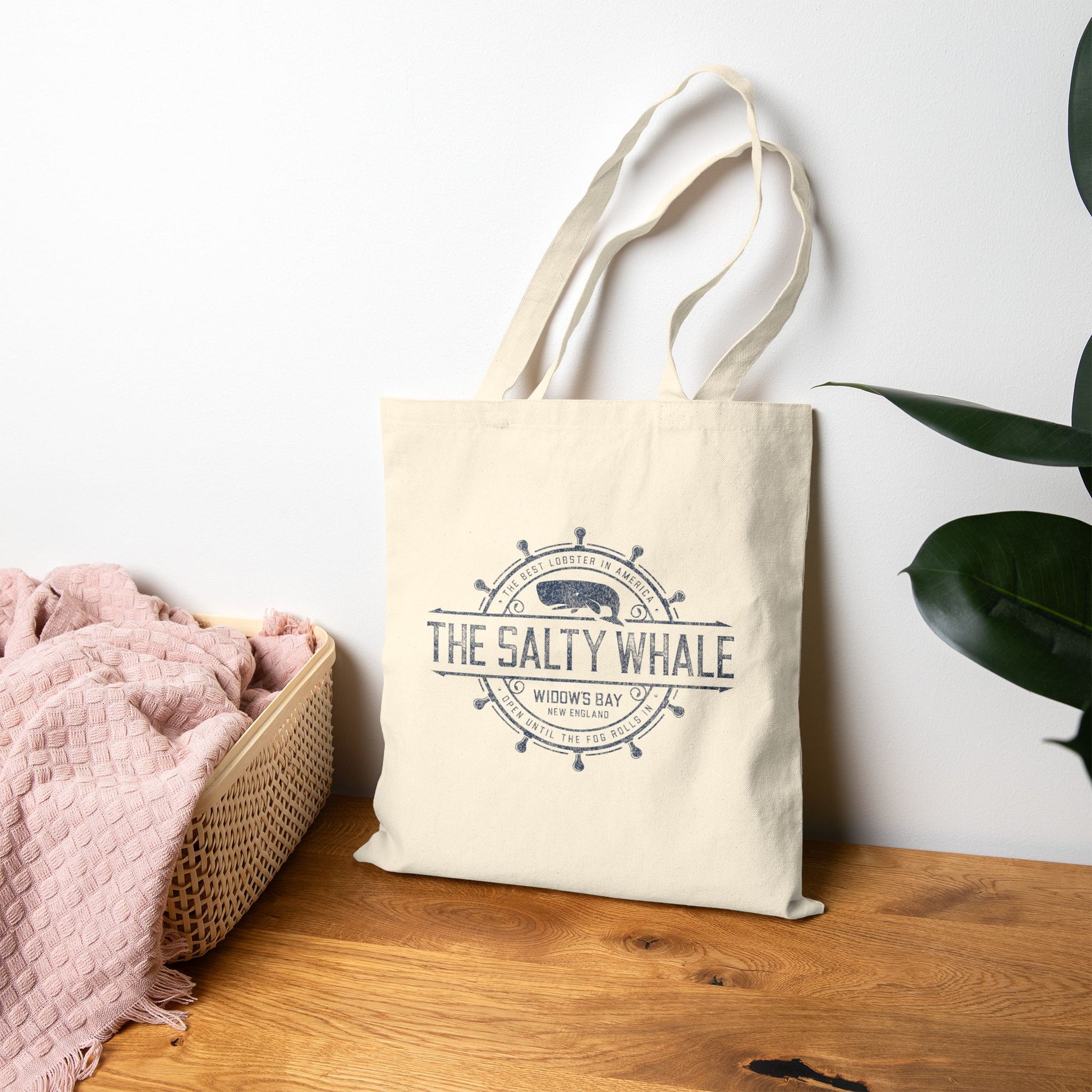 Natural canvas tote bag on floor with vintage The Salty Whale, Widow's Bay TV show nautical grocery shopping