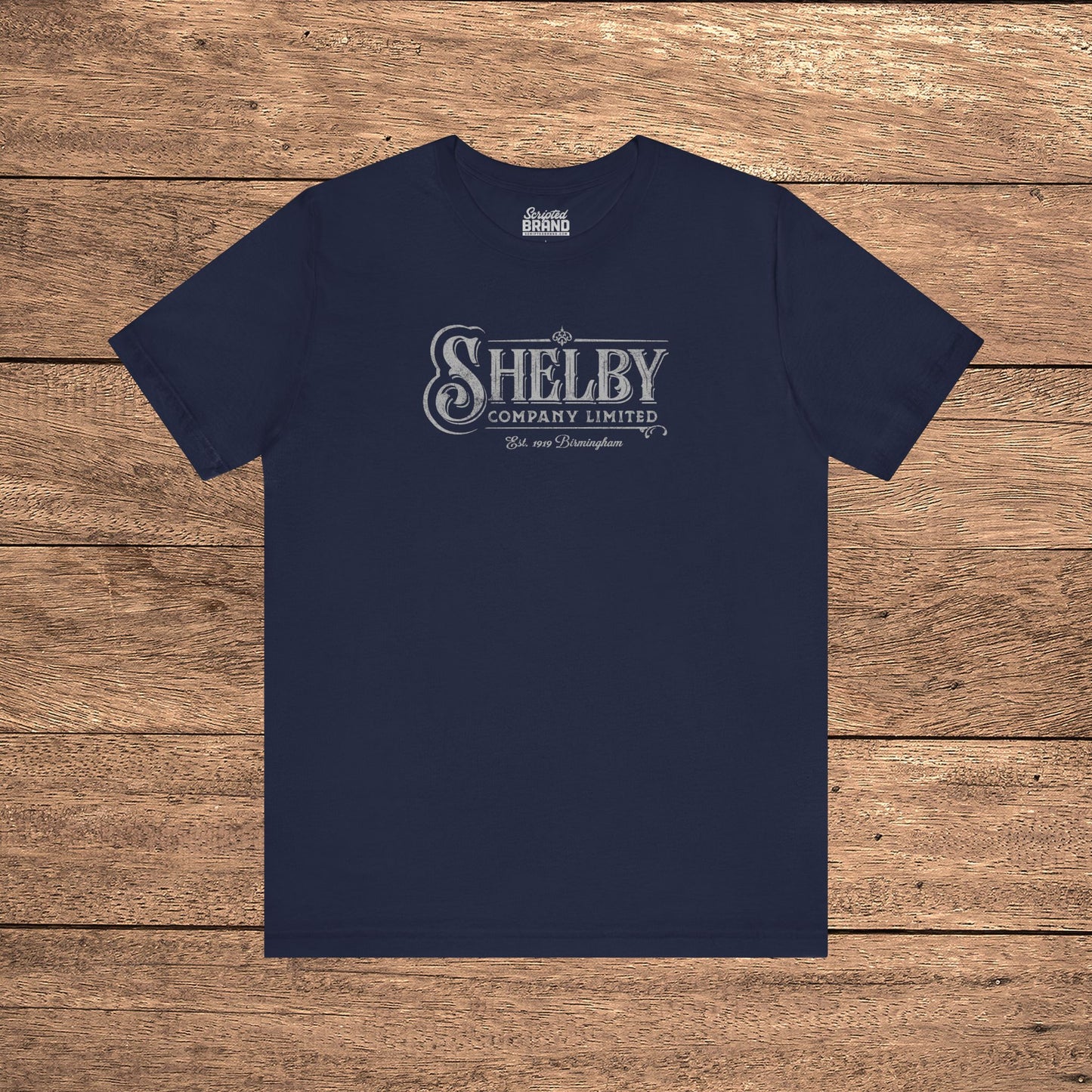 Navy Blue Bella+Canvas 3001 t-shirt featuring a vintage Shelby Company Limited logo from Peaky Blinders.