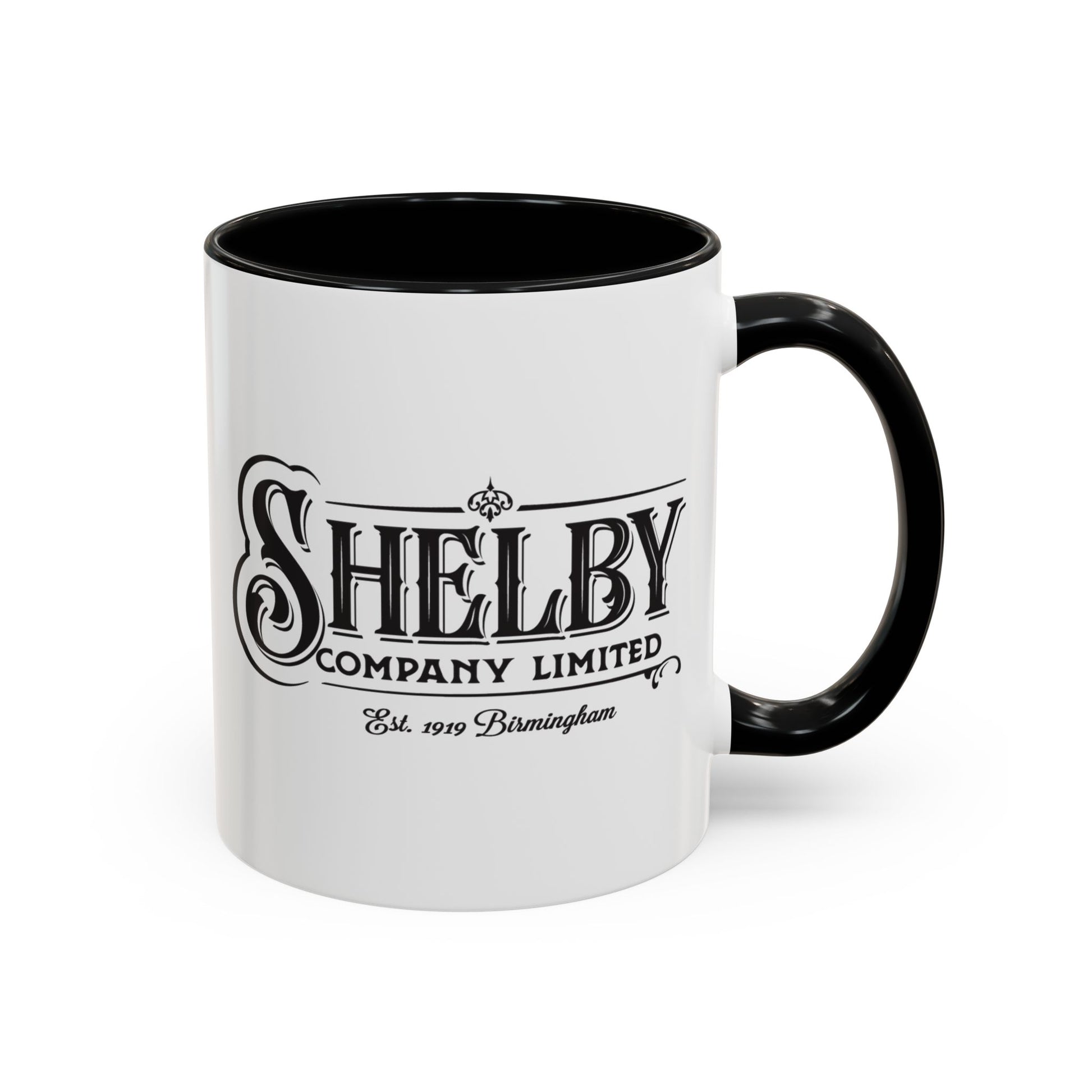 Front view of a 11 oz White Ceramic Mug with black handle/interior featuring the fictional Shelby Company Limited Logo from the TV show Peaky Blinders printed on both sides. Black handle is on the right. Graphic is designed by ScriptedBrand and includes the text "Est. 1919 Birmingham".