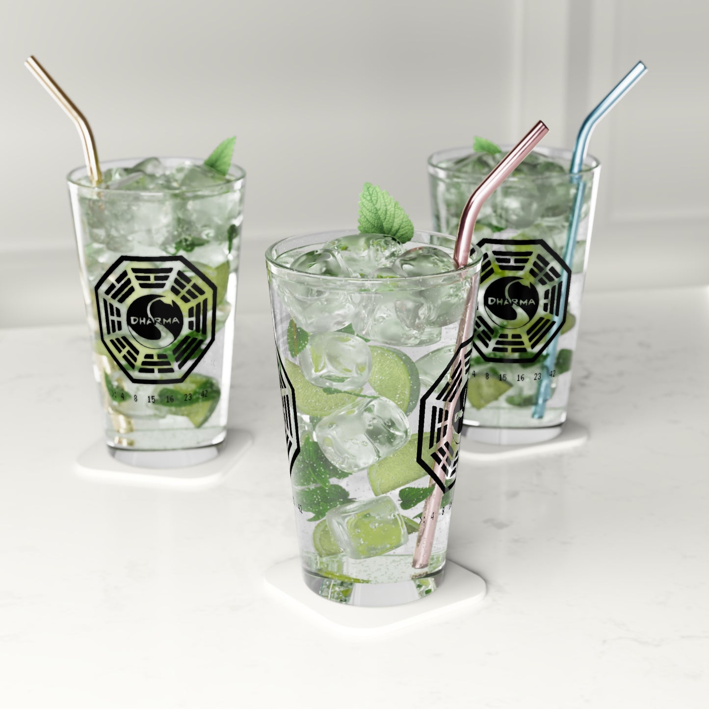 Three Clear 16 oz pint glasses with Dharma Initiative Swan Station logo and hatch numbers from Lost Show, filled with soda