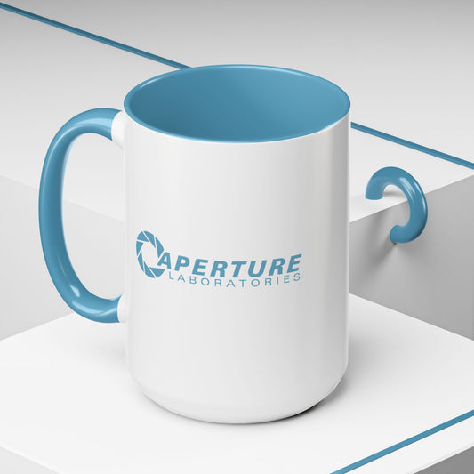 White mug with blue interior and handle featuring 'Aperture Laboratories' logo on a light gray background.