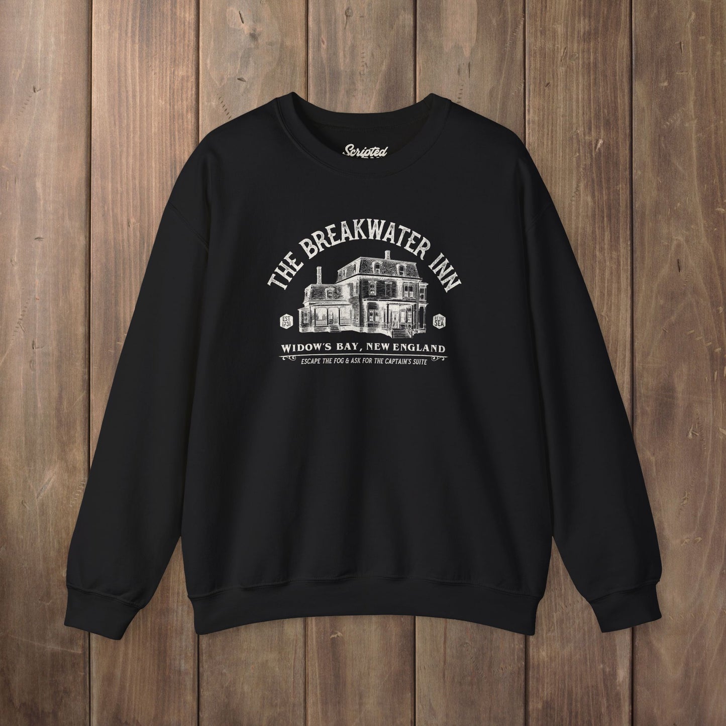 Black crewneck sweatshirt with Breakwater Inn Widow's Bay New England hotel graphic