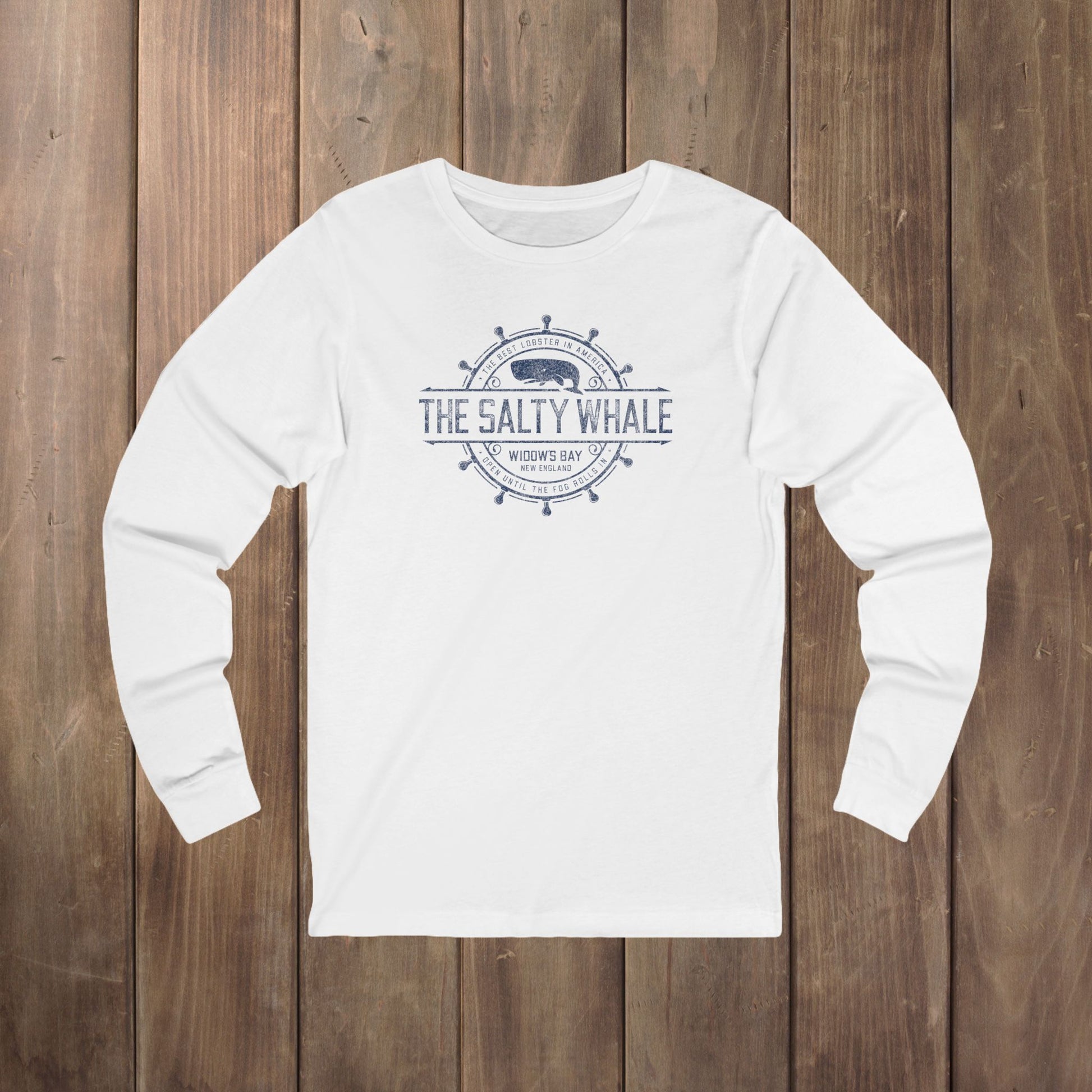White long-sleeve tee with the gold distressed Salty Whale maritime crest logo from Widow's Bay, New England