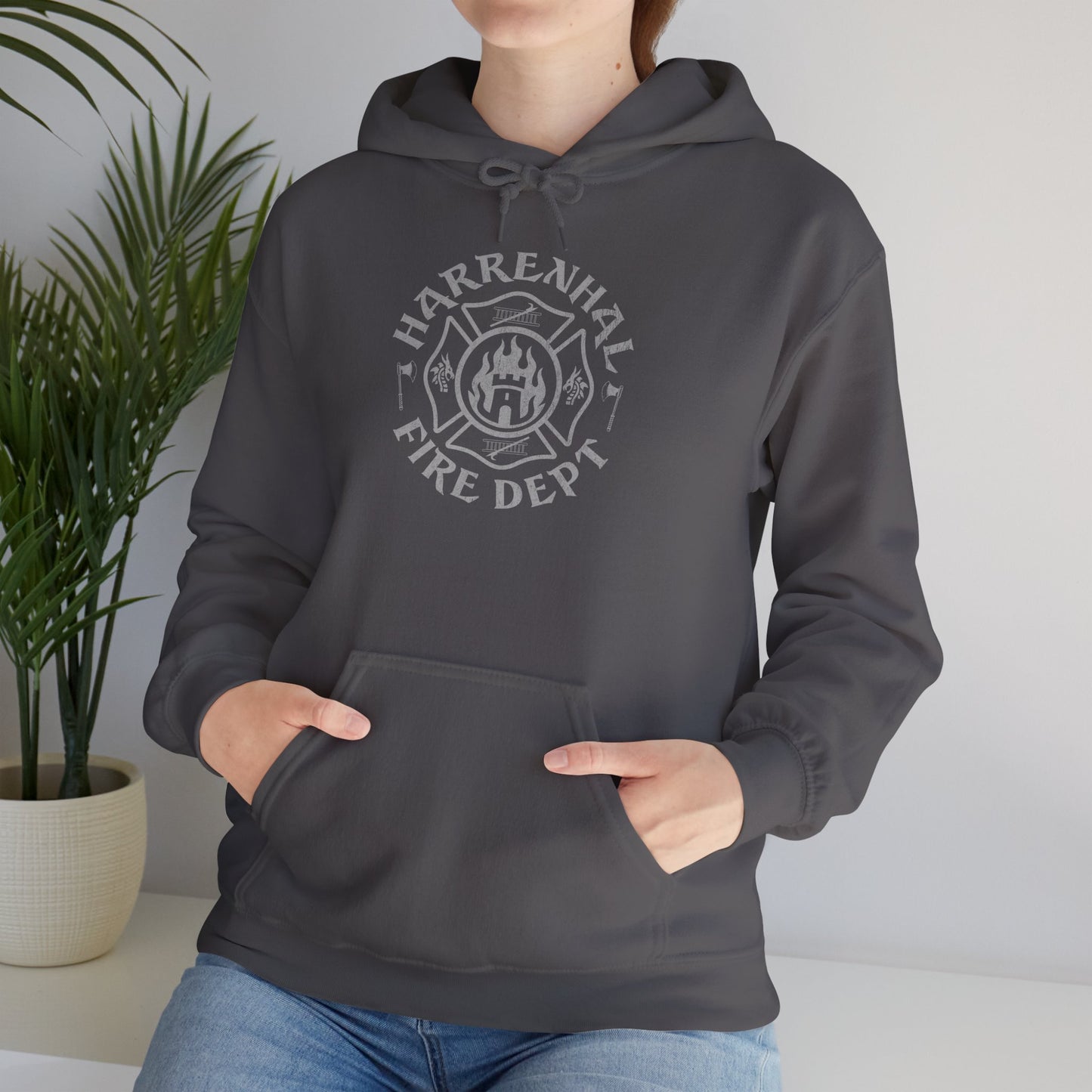 Woman wearing charcoal gray Harrenhal Fire Department vintage distressed graphic hoodie, heavy pullover sweatshirt inspired by Game of Thrones