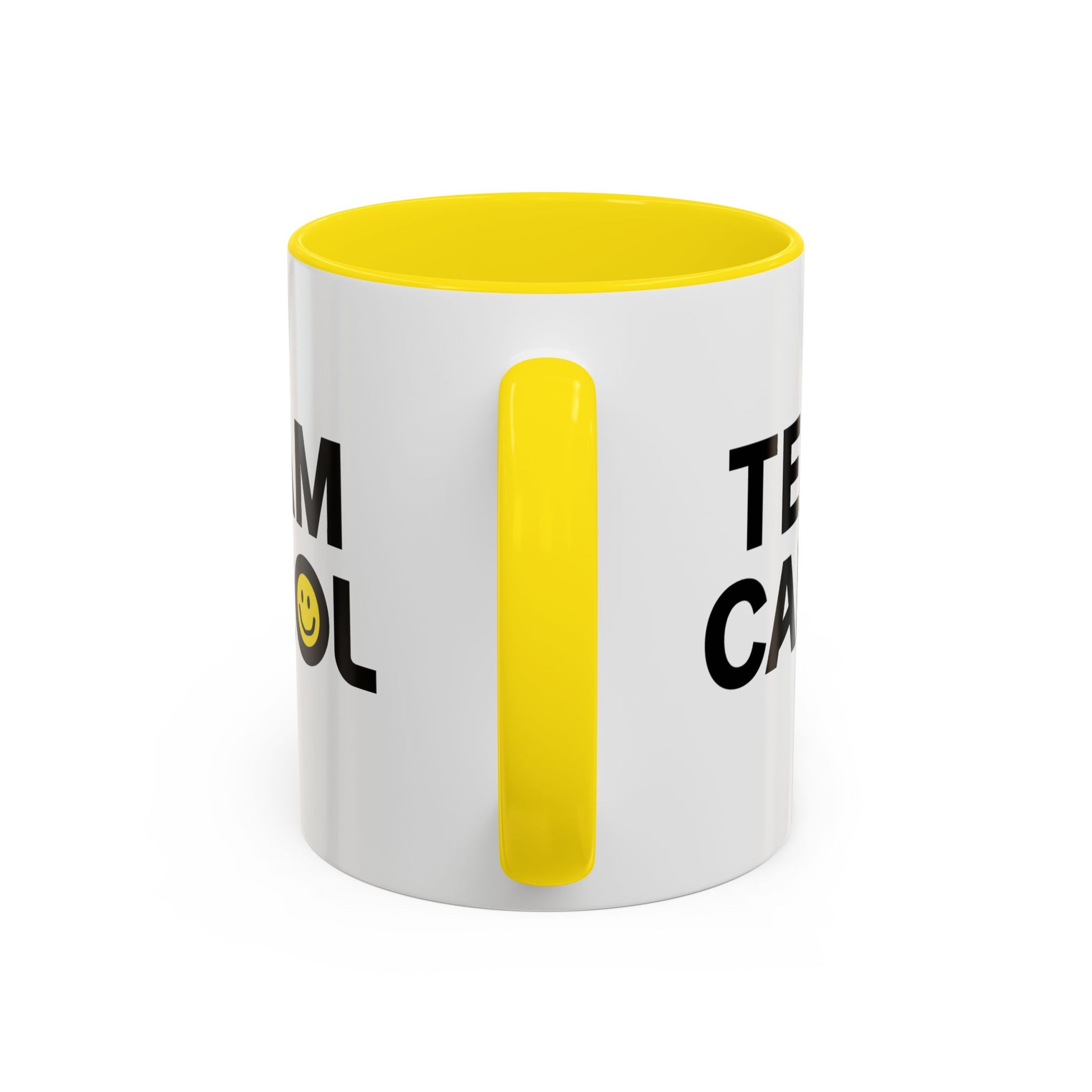 Side view of ceramic accent mug with yellow handle and interior, TEAM CAROL text and smiley face from Pluribus, shown on white background
