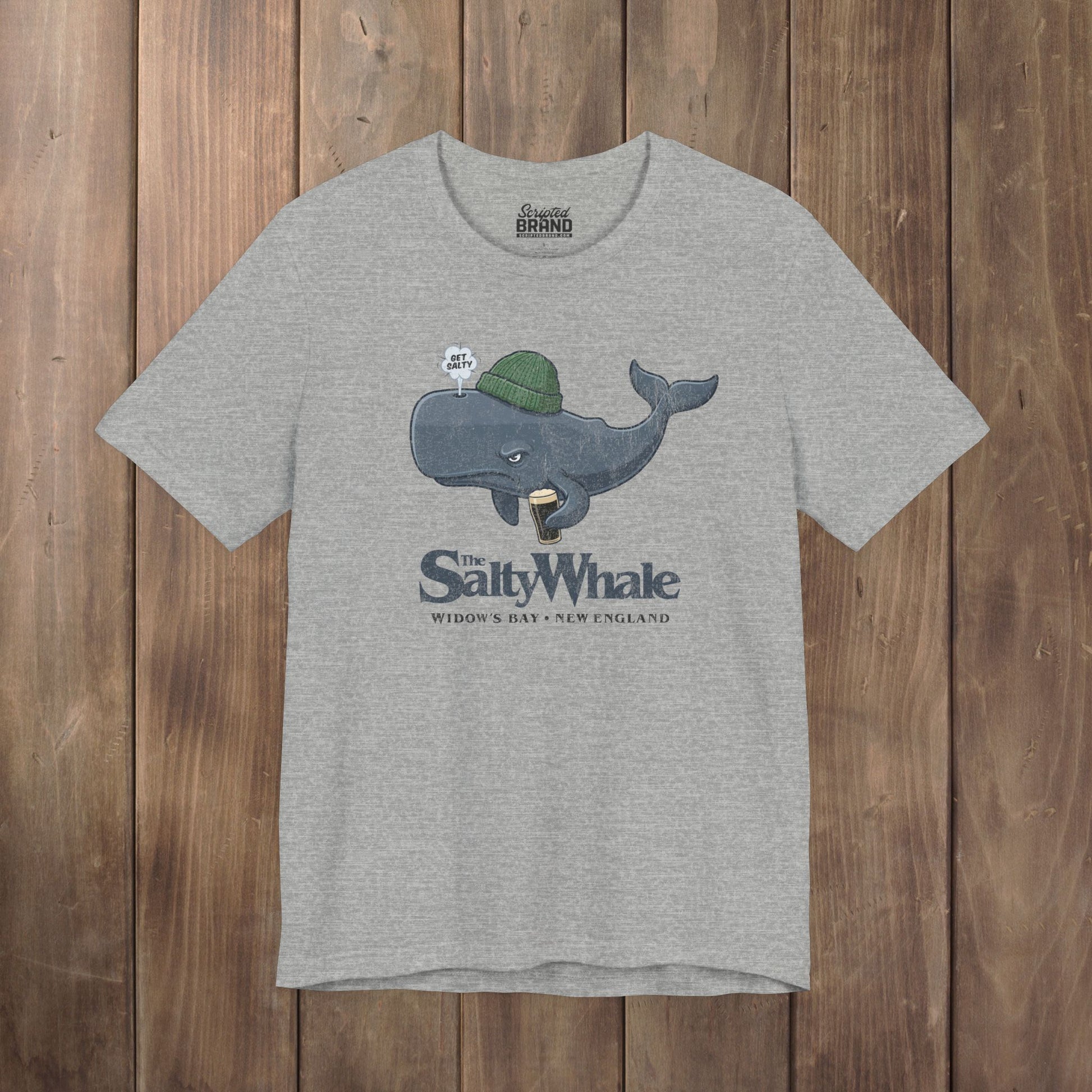 Heather gray 'The Salty Whale' cartoon mascot t-shirt inspired by Widow's Bay Apple TV series, soft Bella+Canvas cotton pub fan tee