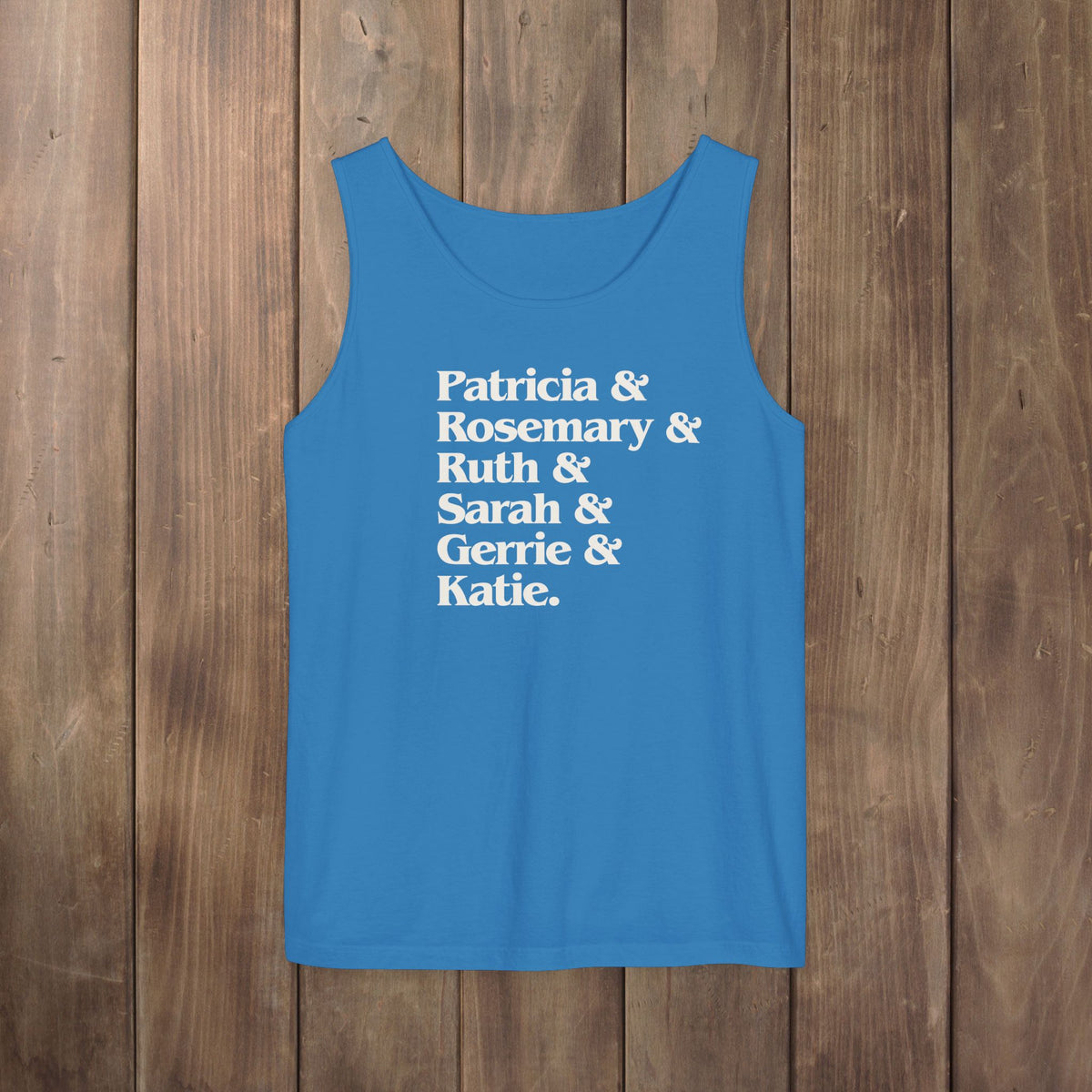 Royal blue garment-dyed Comfort Colors tank top with stacked Women of Widow's Bay show names in ampersand list including Patricia, Ruth, Rosemary