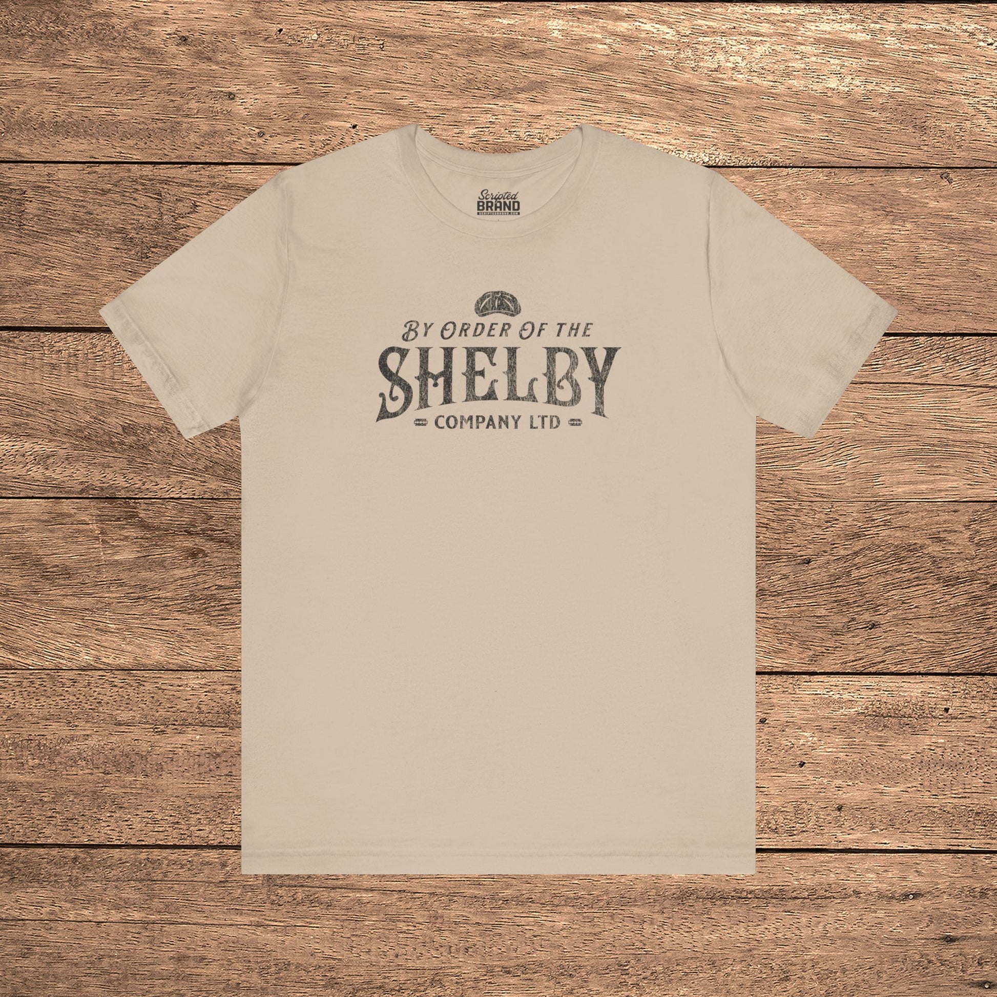 Tan Bella+Canvas 3001 t-shirt featuring a Shelby Company Limited logo graphic from Peaky Blinders.